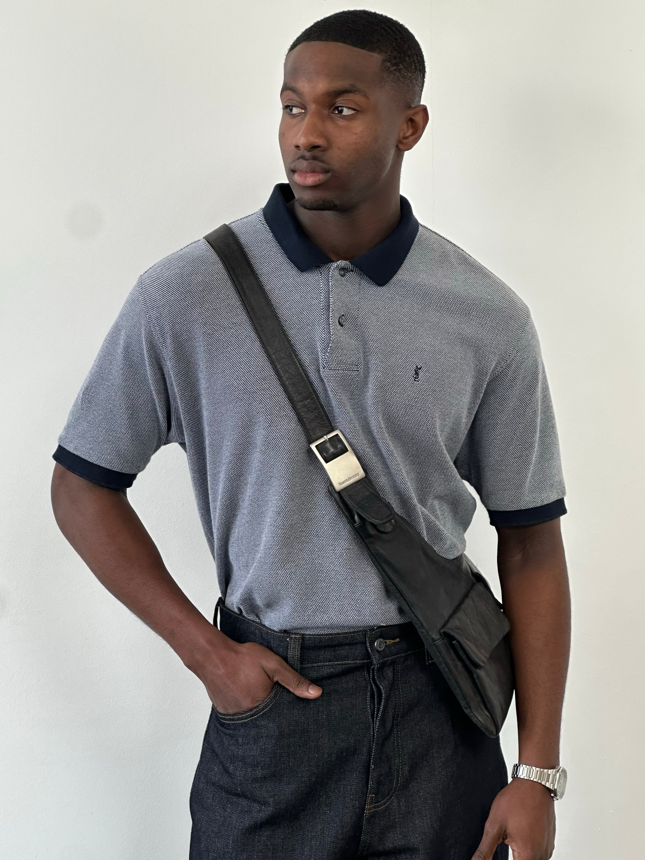 Yves Saint Laurent Pour Homme 1990s pure cotton short sleeve polo shirt in XL, shown in navy blue with classic collar and buttons.