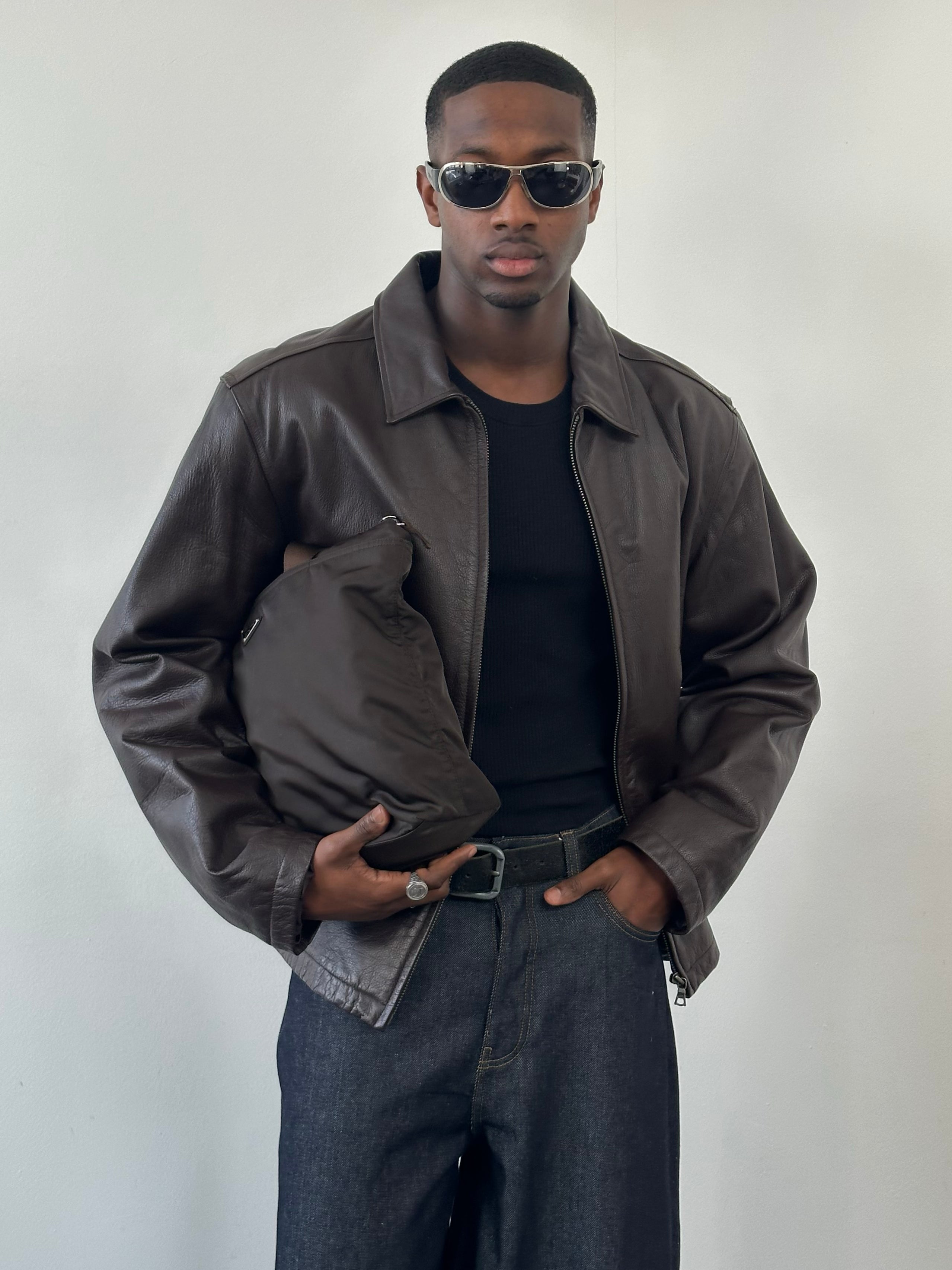Vintage 1990s boxy minimal leather jacket in XL, featuring a classic design and authentic leather texture.