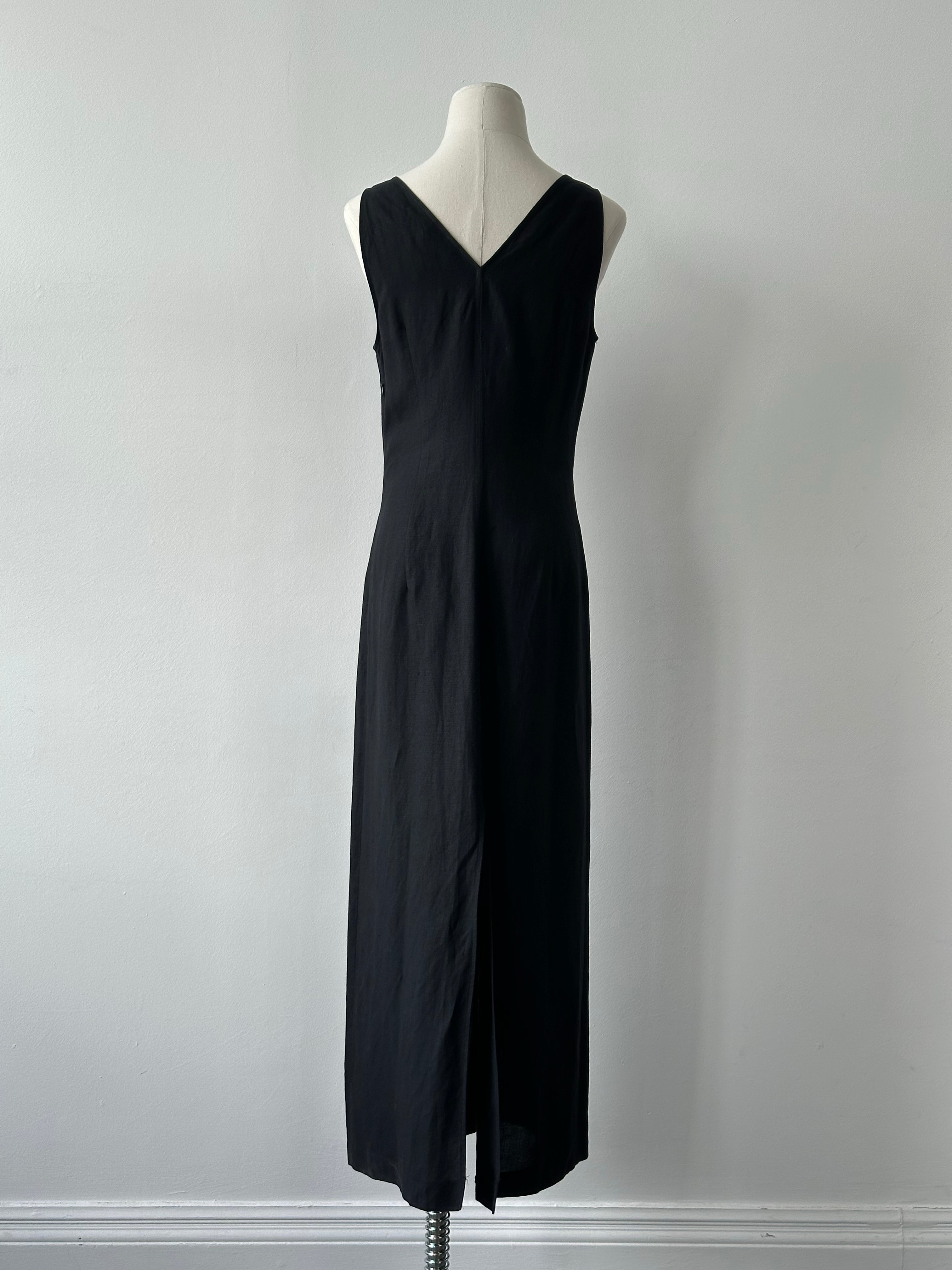 Marella 1990s linen V-neck floor-length dress in S/M displayed on a hanger, showcasing its flowing fabric and vintage-inspired style.