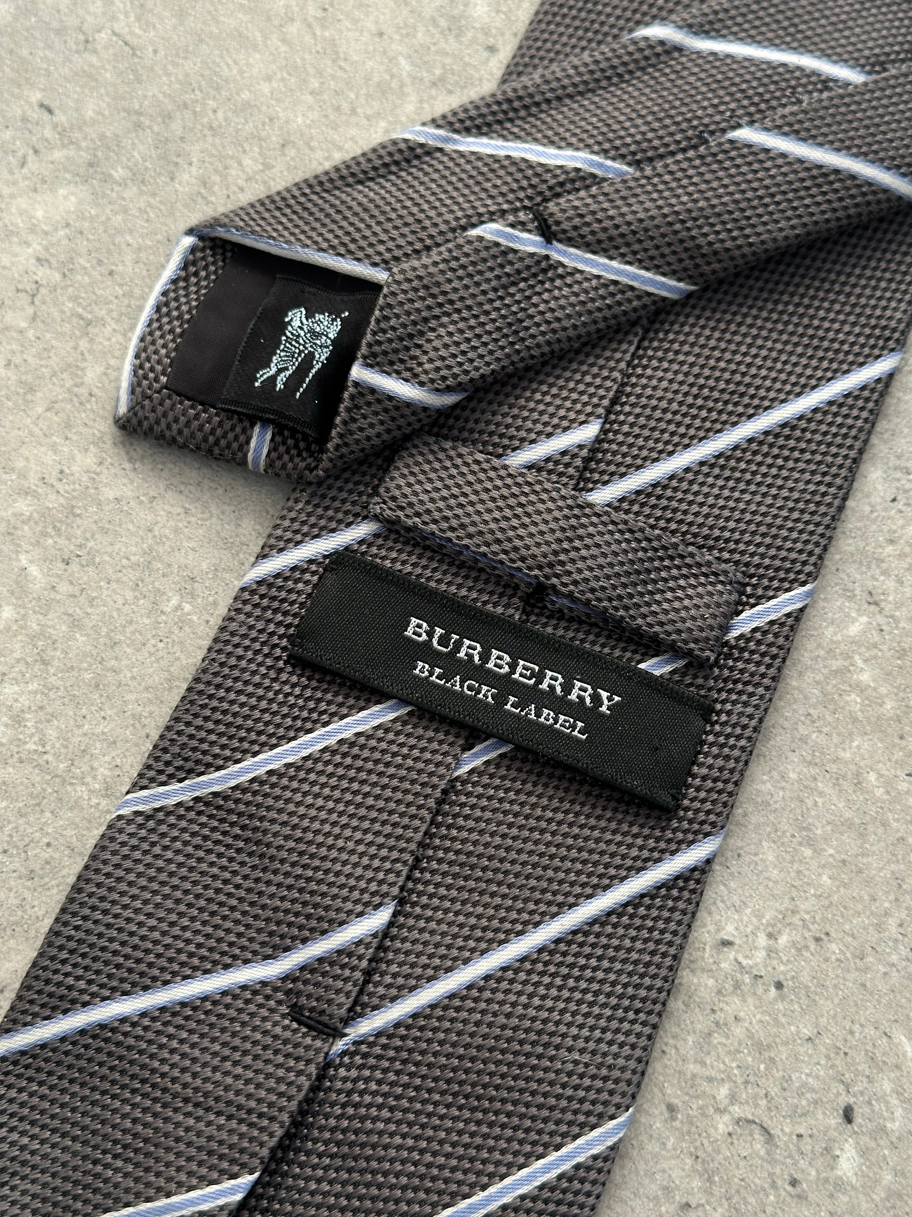 Burberry Black Label 2000s pure silk striped tie with classic pattern, shown laid flat with detailed fabric texture.