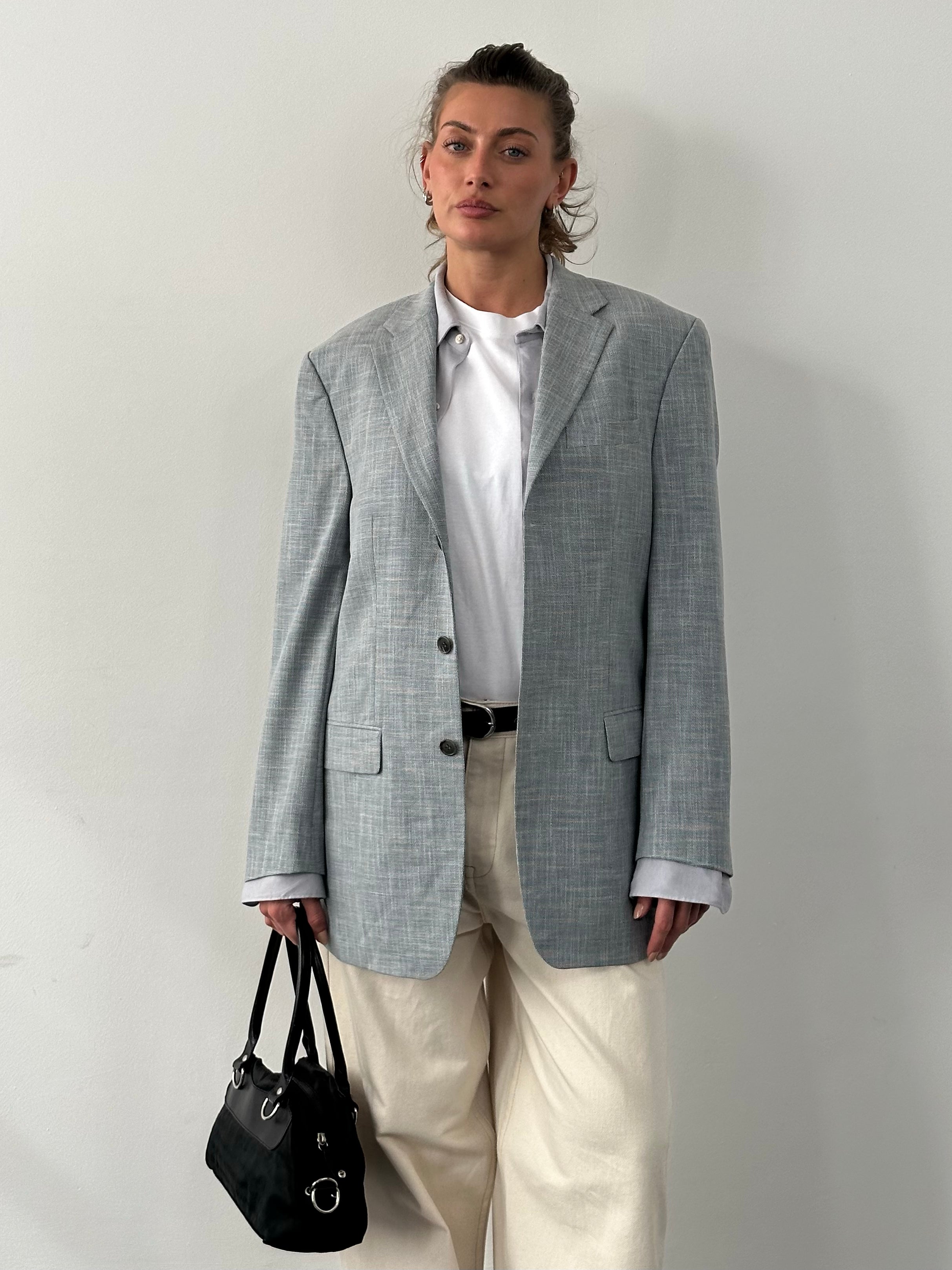 Loro Piana Rene Lezard 1990s single-breasted blazer in size L/XL, tailored fit, luxurious fabric, shown on a hanger.