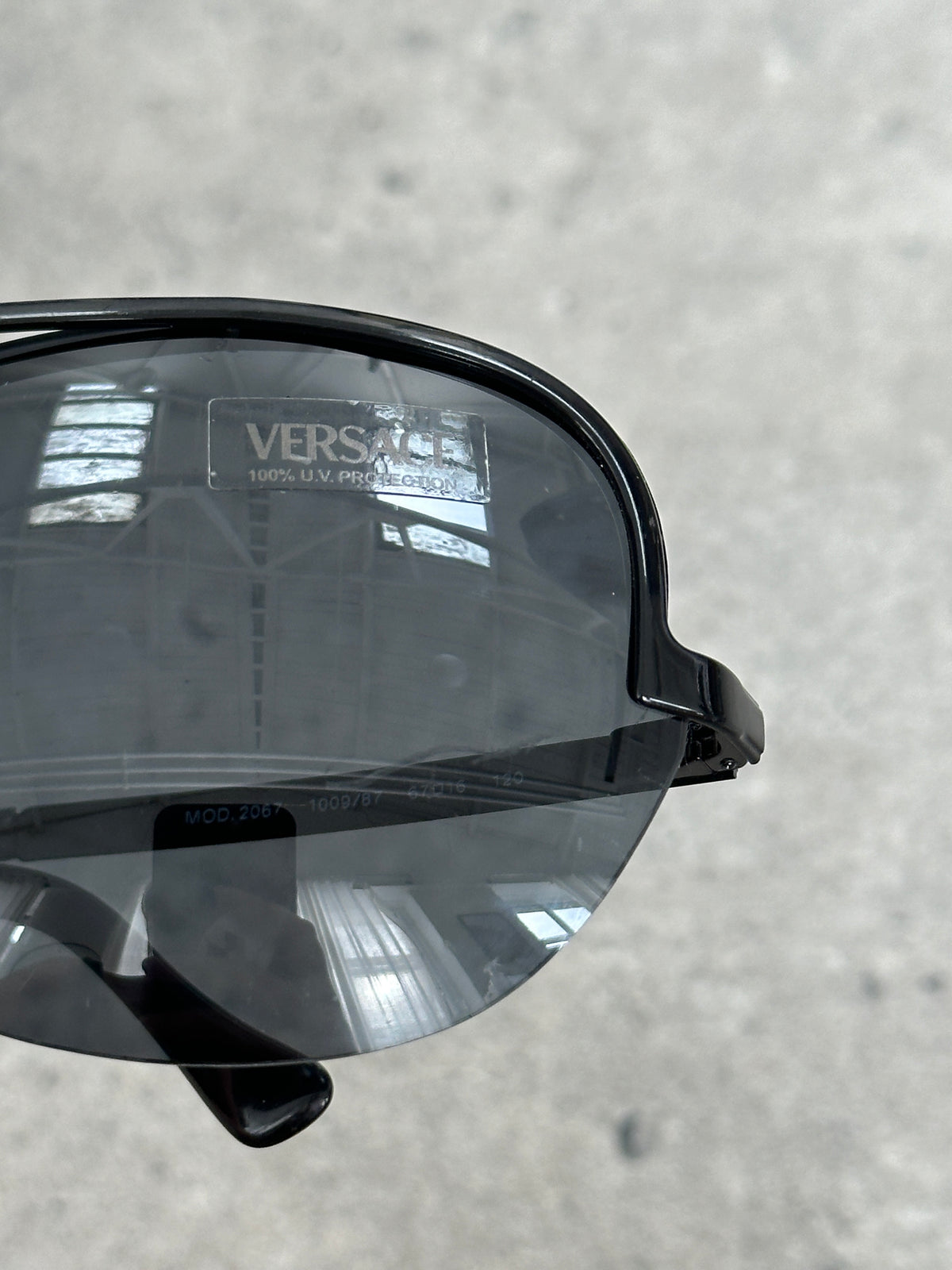 Versace 2000s Shield Aviator Logo Sunglasses with bold metal frames and iconic Versace logo on the temples.