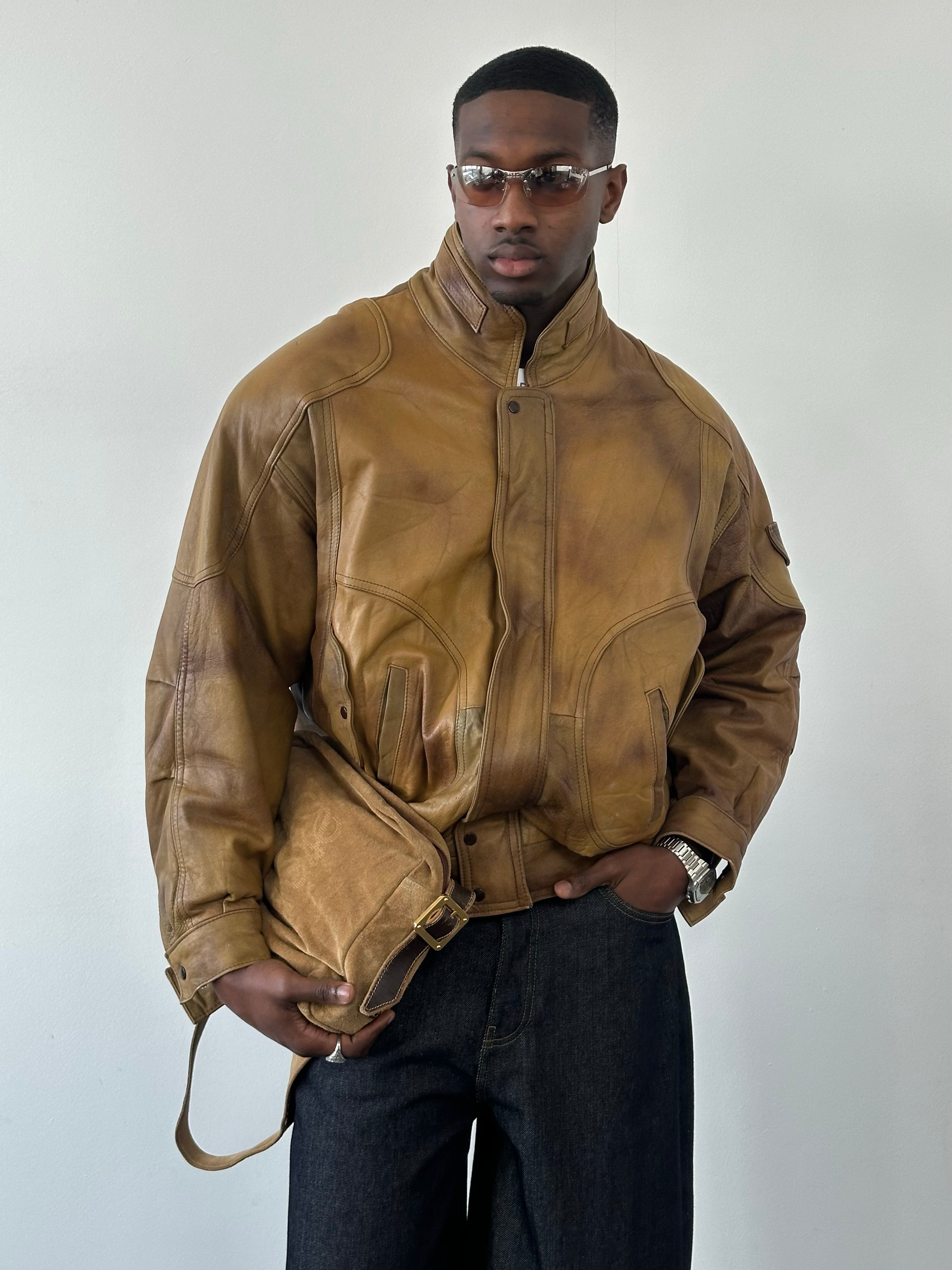 Vintage 1990s leather high neck bomber jacket, men's size large, featuring classic design and authentic leather material.