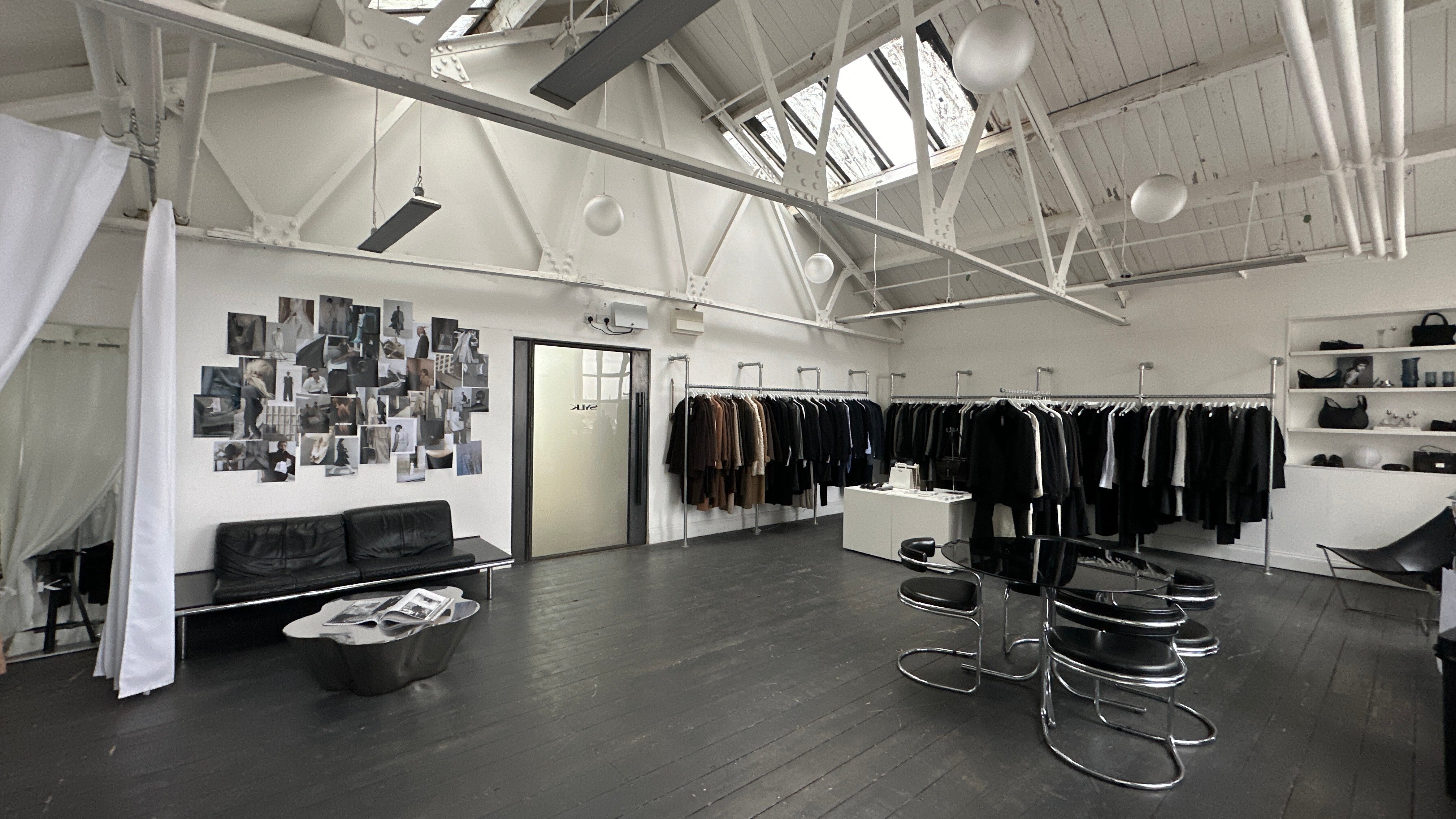 Vintage Manchester studio with curated decor and industrial aesthetic, featuring SYLK branding and creative workspace ambiance.