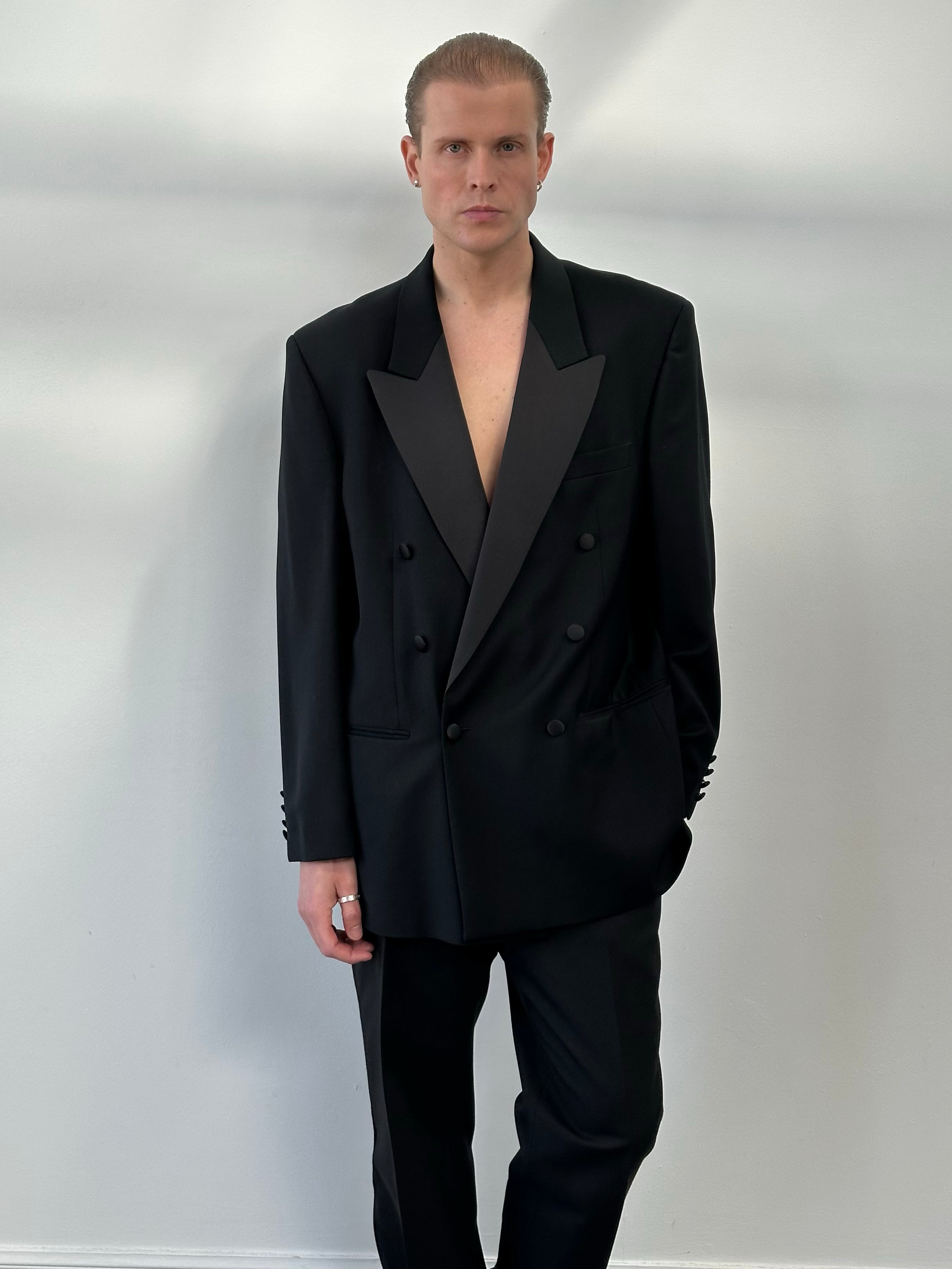 Pierre Cardin 1990s wool double-breasted tuxedo suit in size 46R/W32, shown on a hanger with a classic lapel and tailored fit.