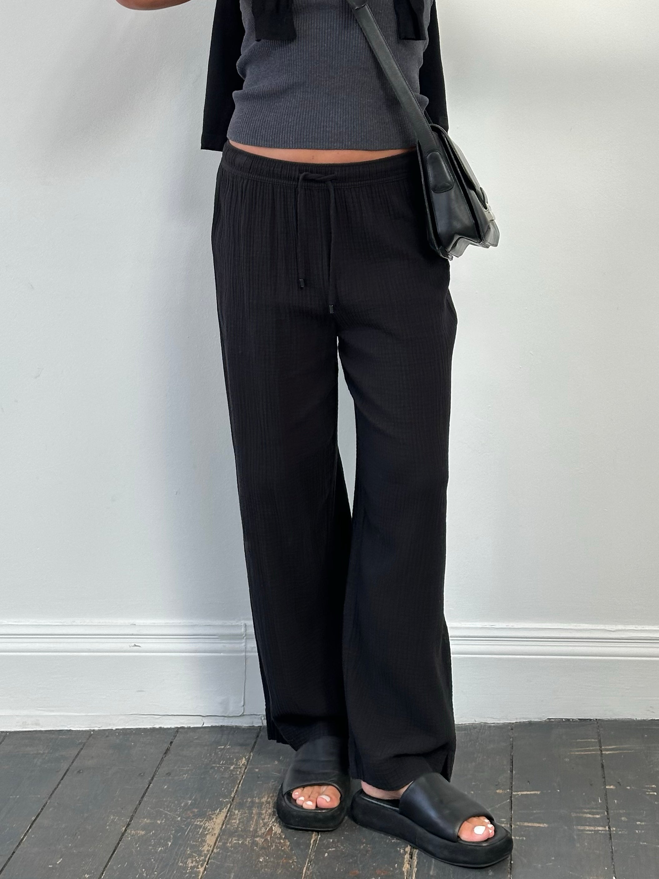 DKNY beachwear wide leg cotton trousers in natural beige, featuring a relaxed fit and high waist, size W28-32.