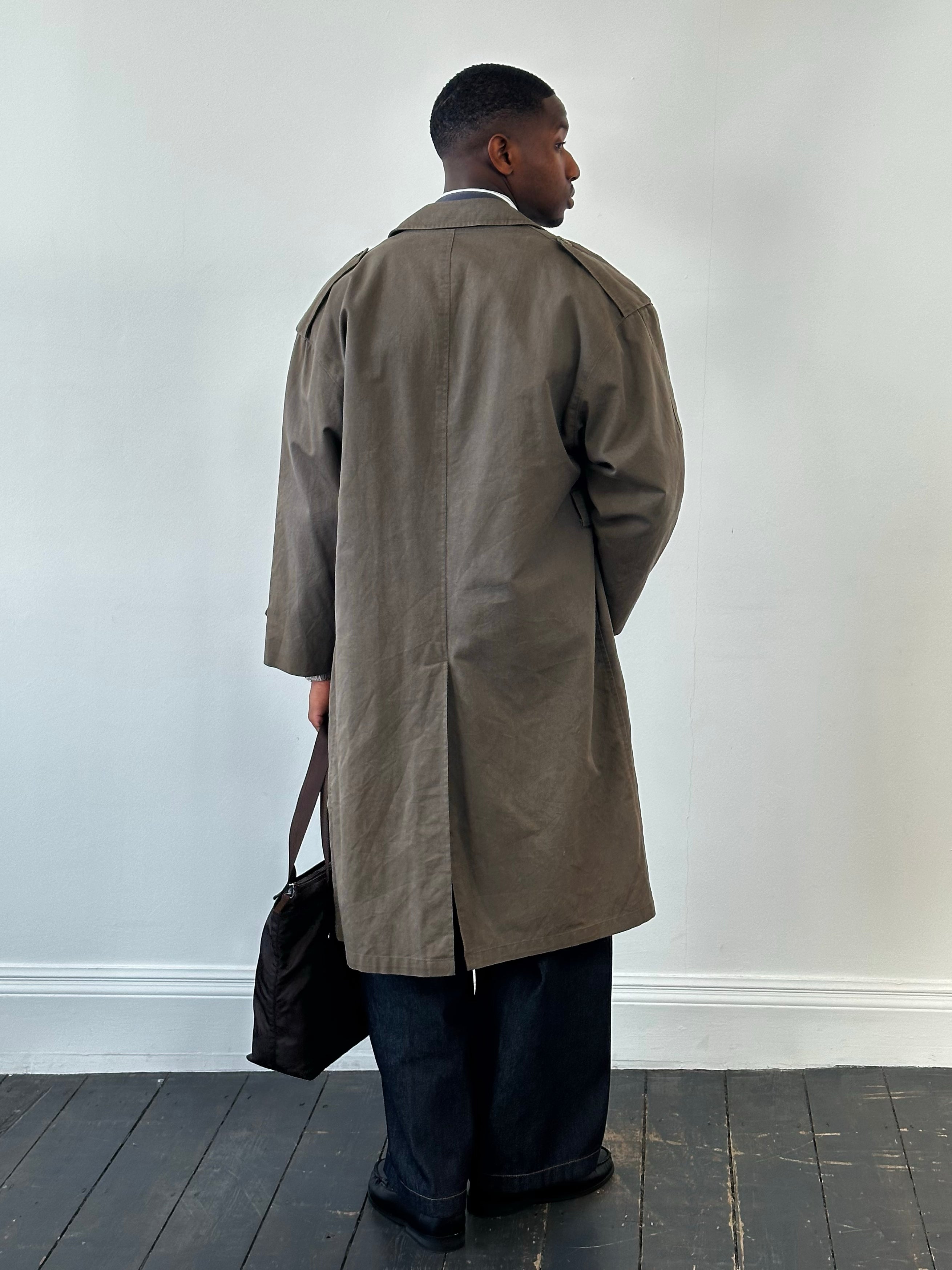 Christian Dior Le Connaisseur 1980s cotton double-breasted trench coat, XL, shown on a hanger with visible collar and button details.