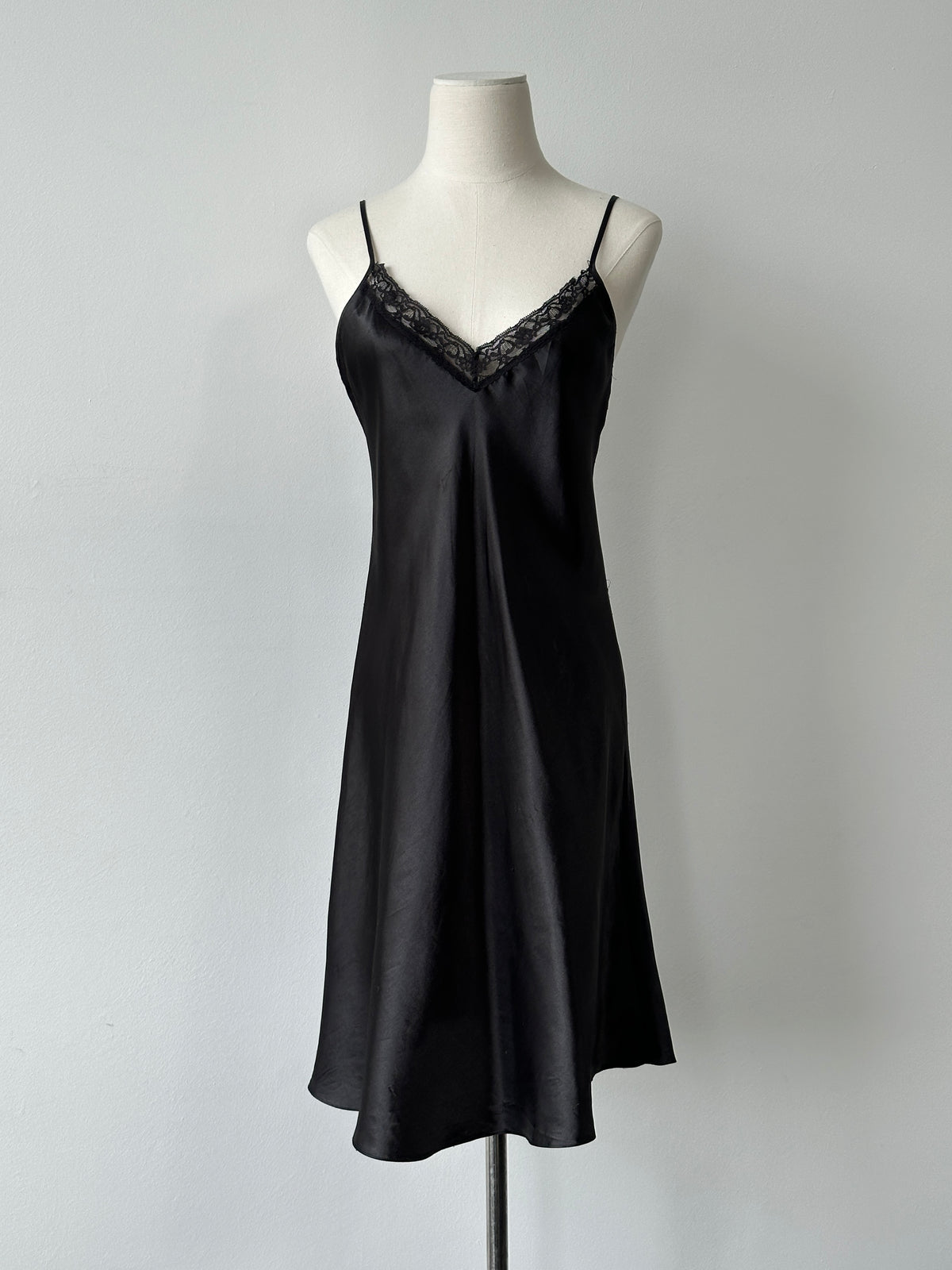 Vintage 1990s satin lace midi slip dress, size M, featuring elegant lace details and a smooth satin finish.