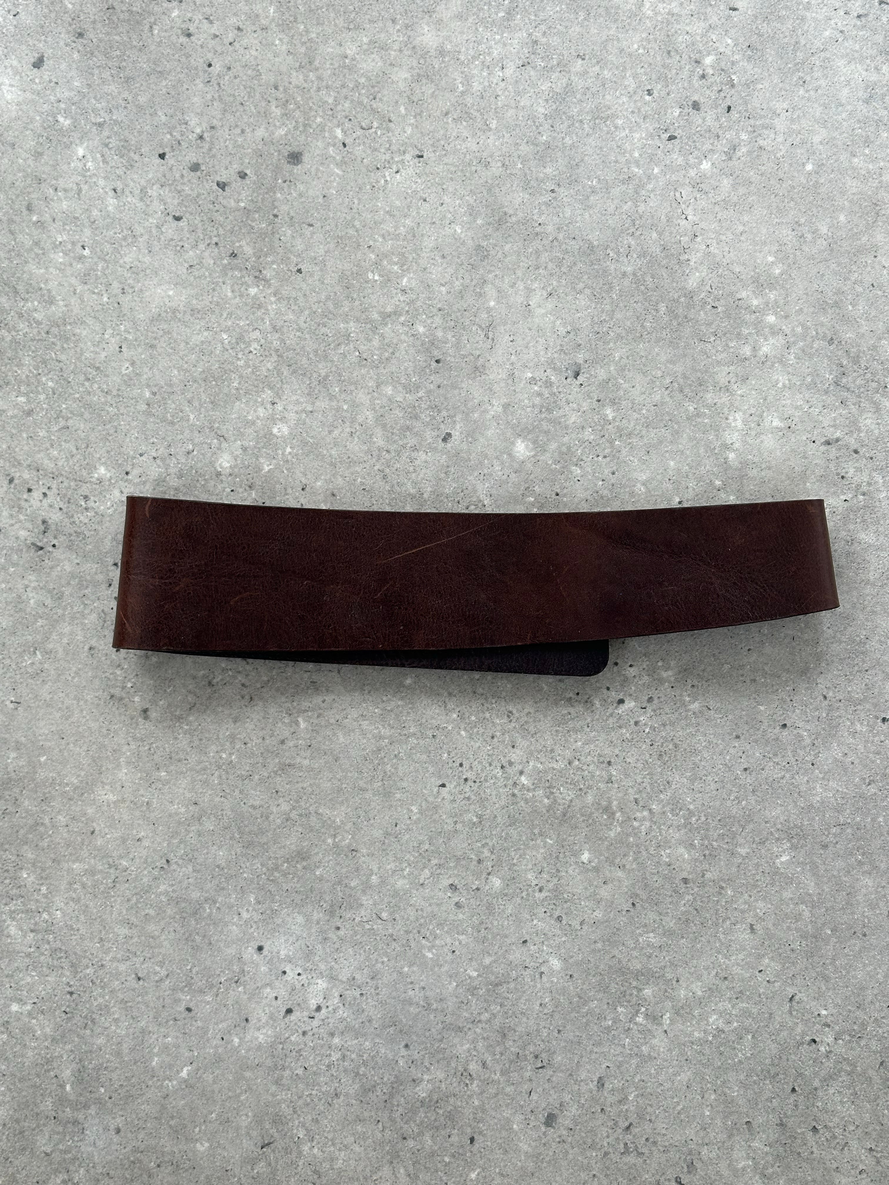Joseph 1990s leather chunky belt with wide strap and buckle, showing detailed texture and rich leather finish.
