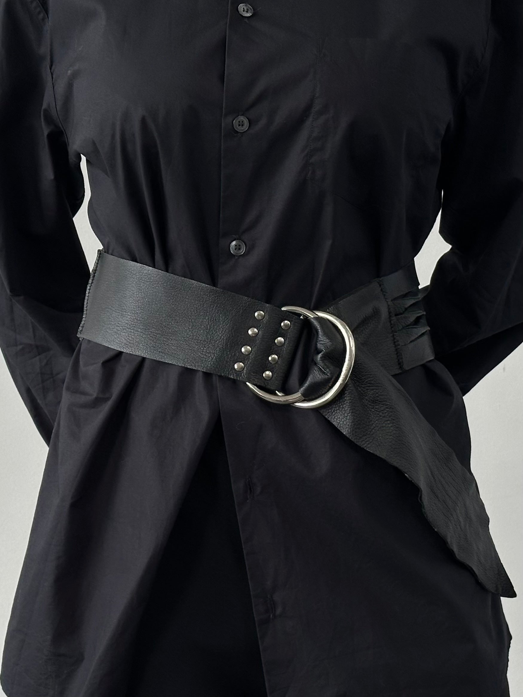 Versace Versus 1990s leather chunky belt with bold black design and silver-tone buckle, displayed on a neutral background.