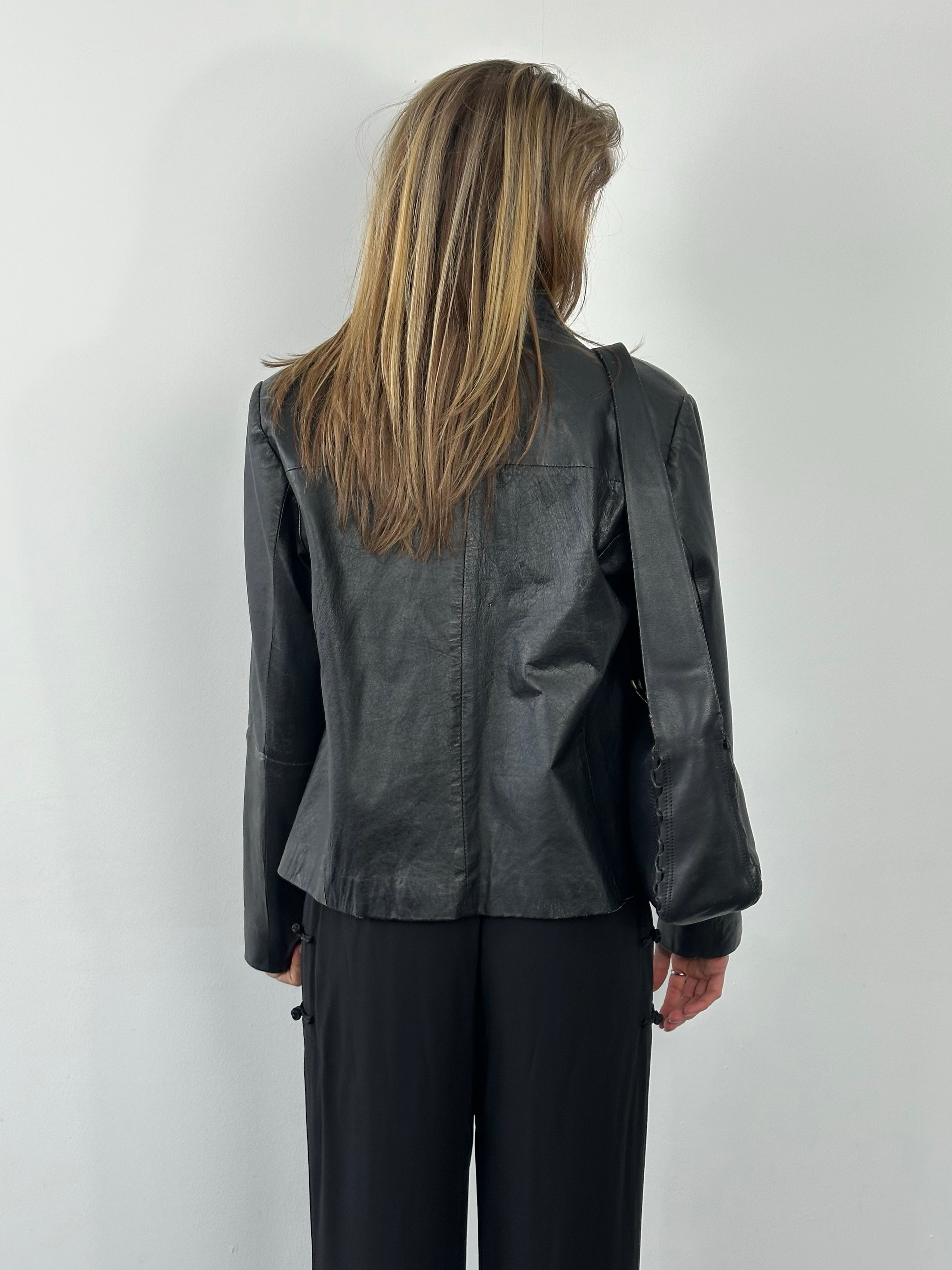 Vintage 1990s leather high neck jacket by Vintage, shown in dark brown with a high collar and classic leather design.