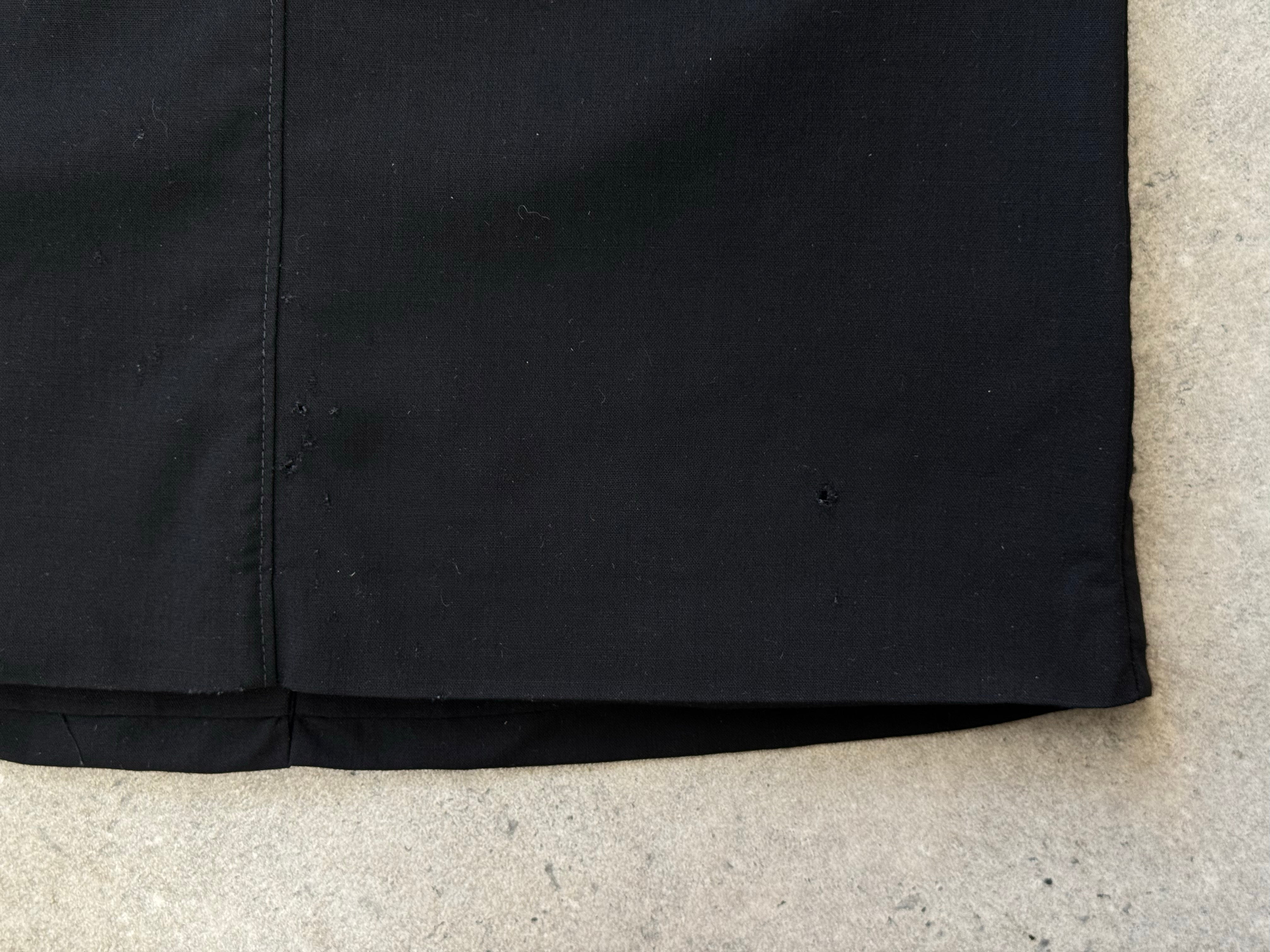 Nicole Farhi 1990s pure wool sleeveless top in XS, shown in a close-up image highlighting the fabric and classic design.