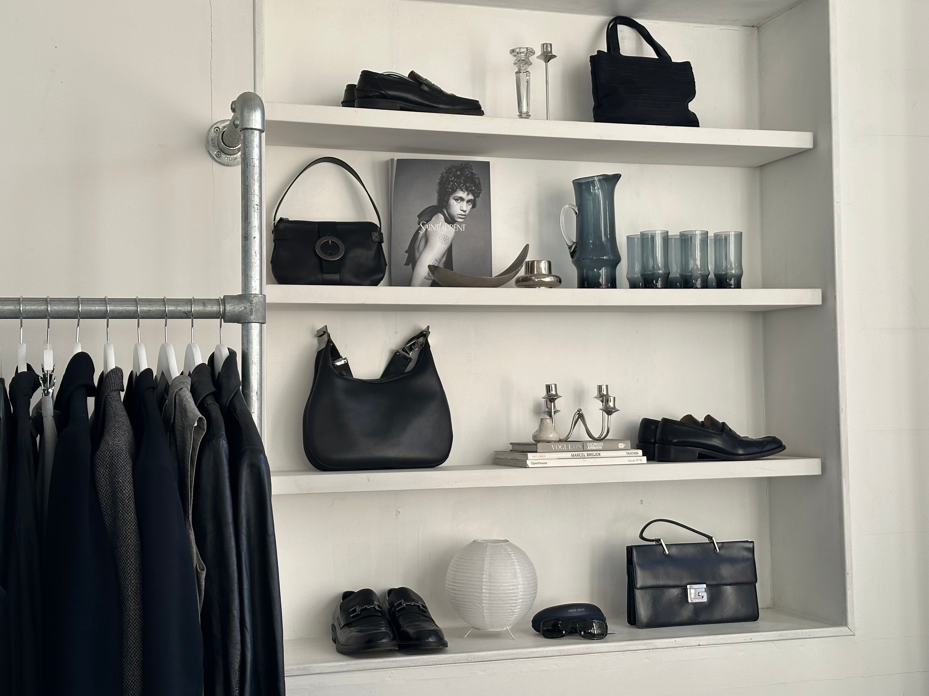 Vintage designer accessories displayed on Manchester shelving for studio appointments at SYLK.