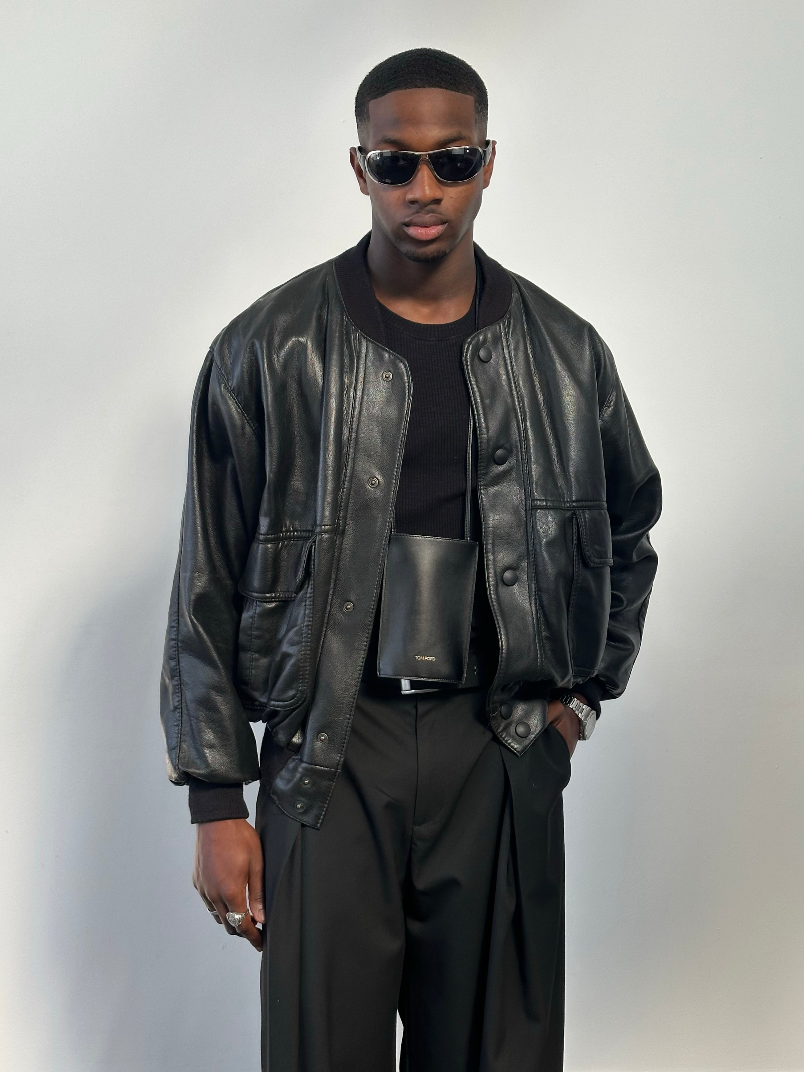 Vintage Italian 1990s leather blouson bomber jacket in XL, featuring classic design and aged leather details.