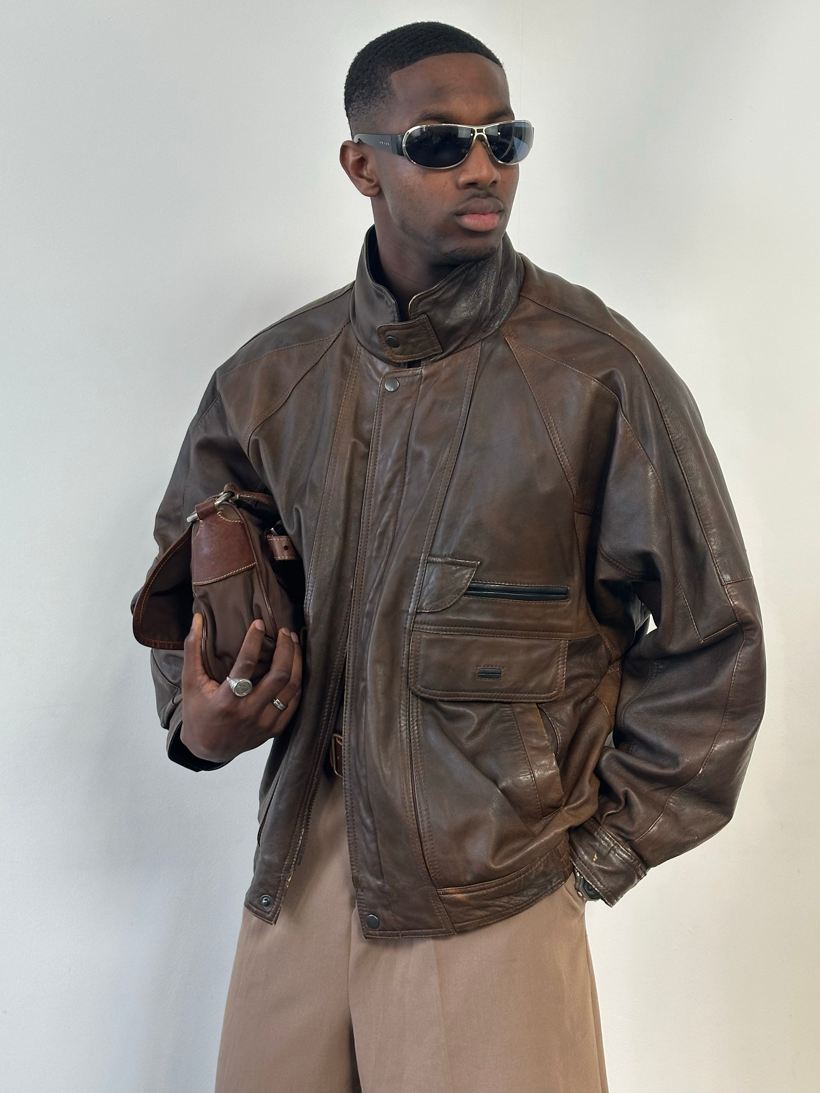 Vintage 1990s high neck leather bomber jacket in XL, featuring classic leather texture and vintage style details.