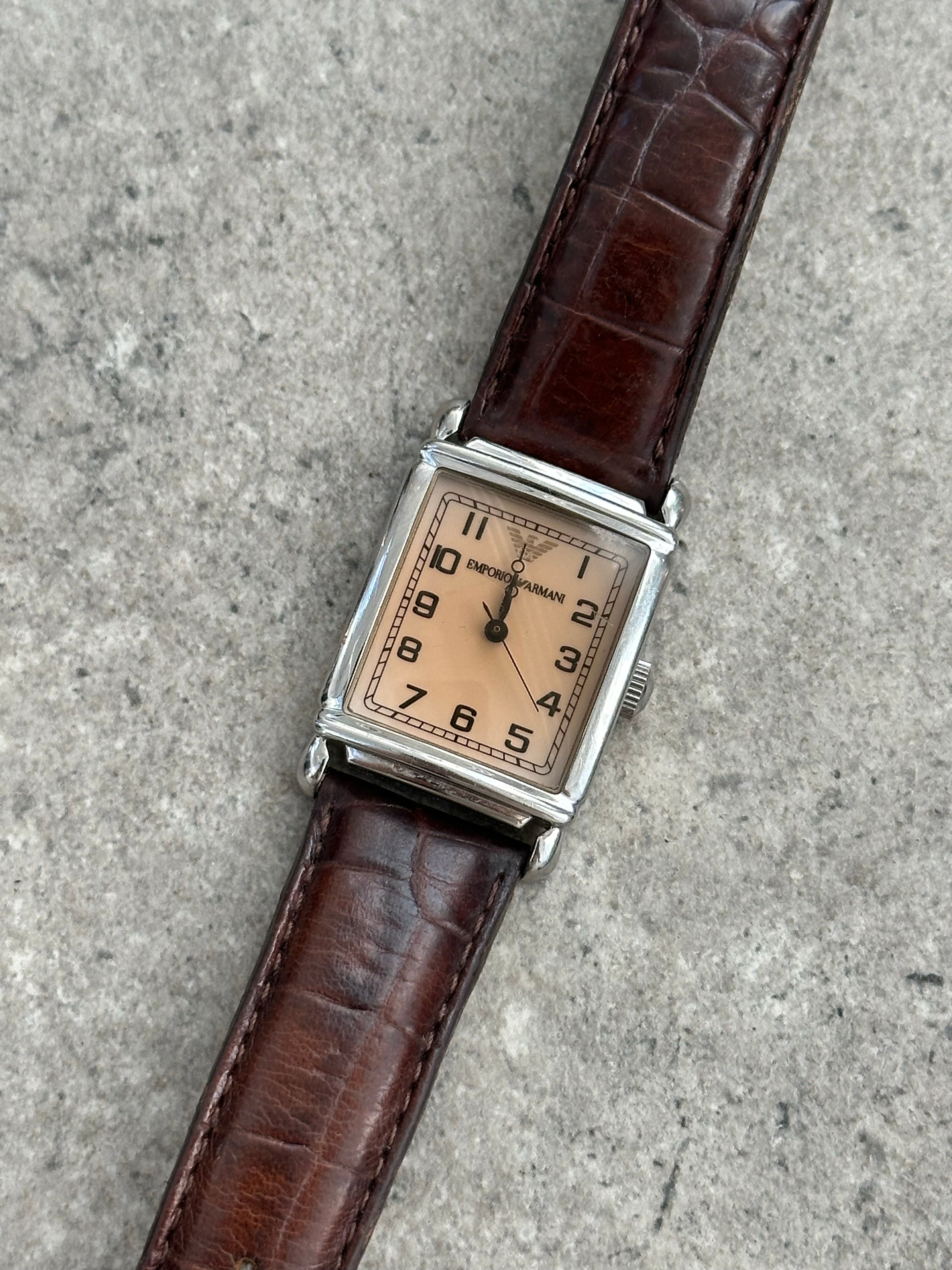 Emporio Armani leather logo watch with classic design, featuring a sleek leather strap and the Armani logo on the dial.