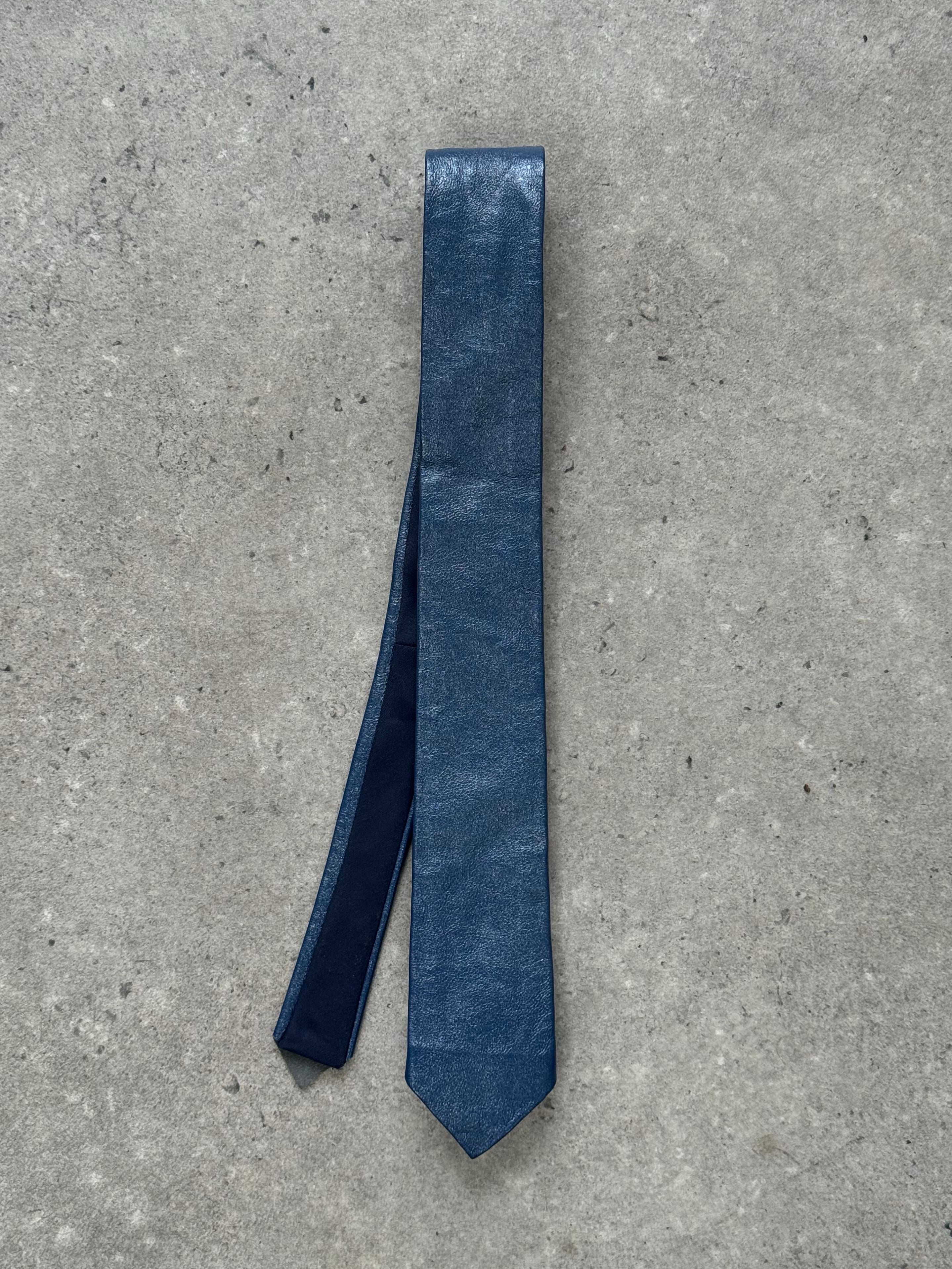 Vintage 1980s leather skinny tie, stylish fashion accessory with textured leather finish, ideal for retro and formal outfits.