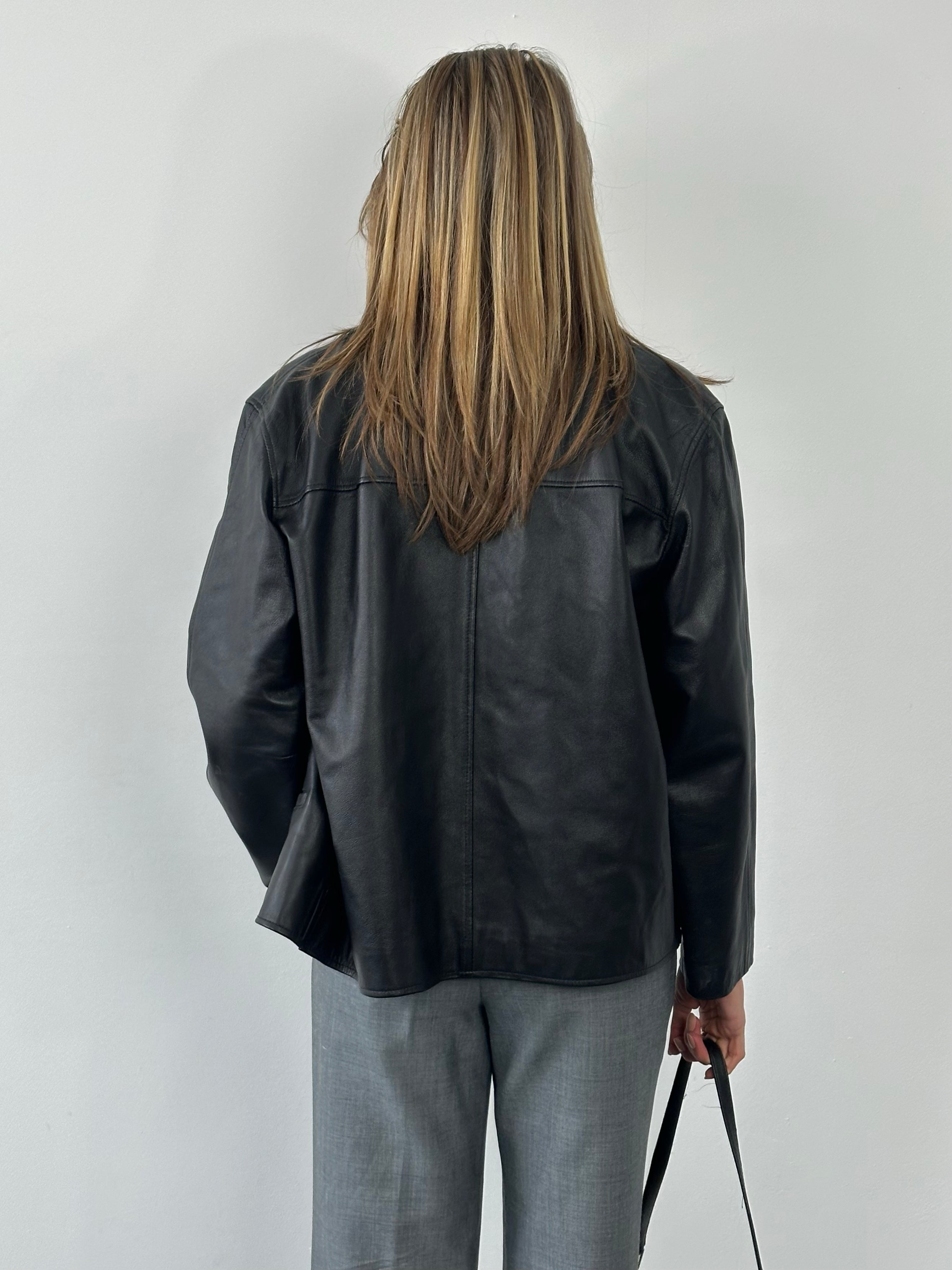 Vintage 1990s boxy leather jacket in black, featuring classic design and metal zipper, by Vintage brand.