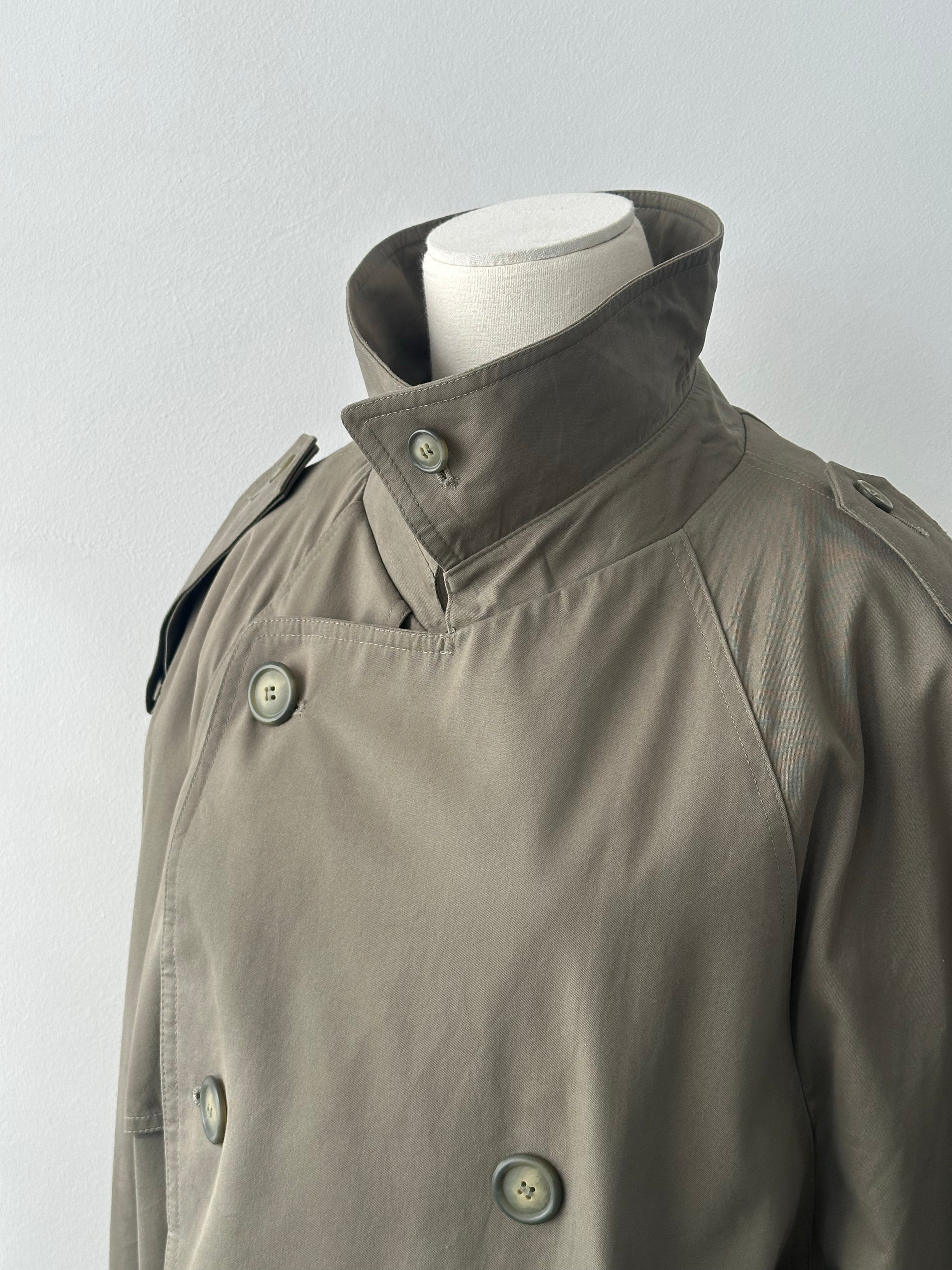 London Fog 1980s cotton belted trench coat in XL, classic beige color, shown on model with double-breasted design and waist belt.