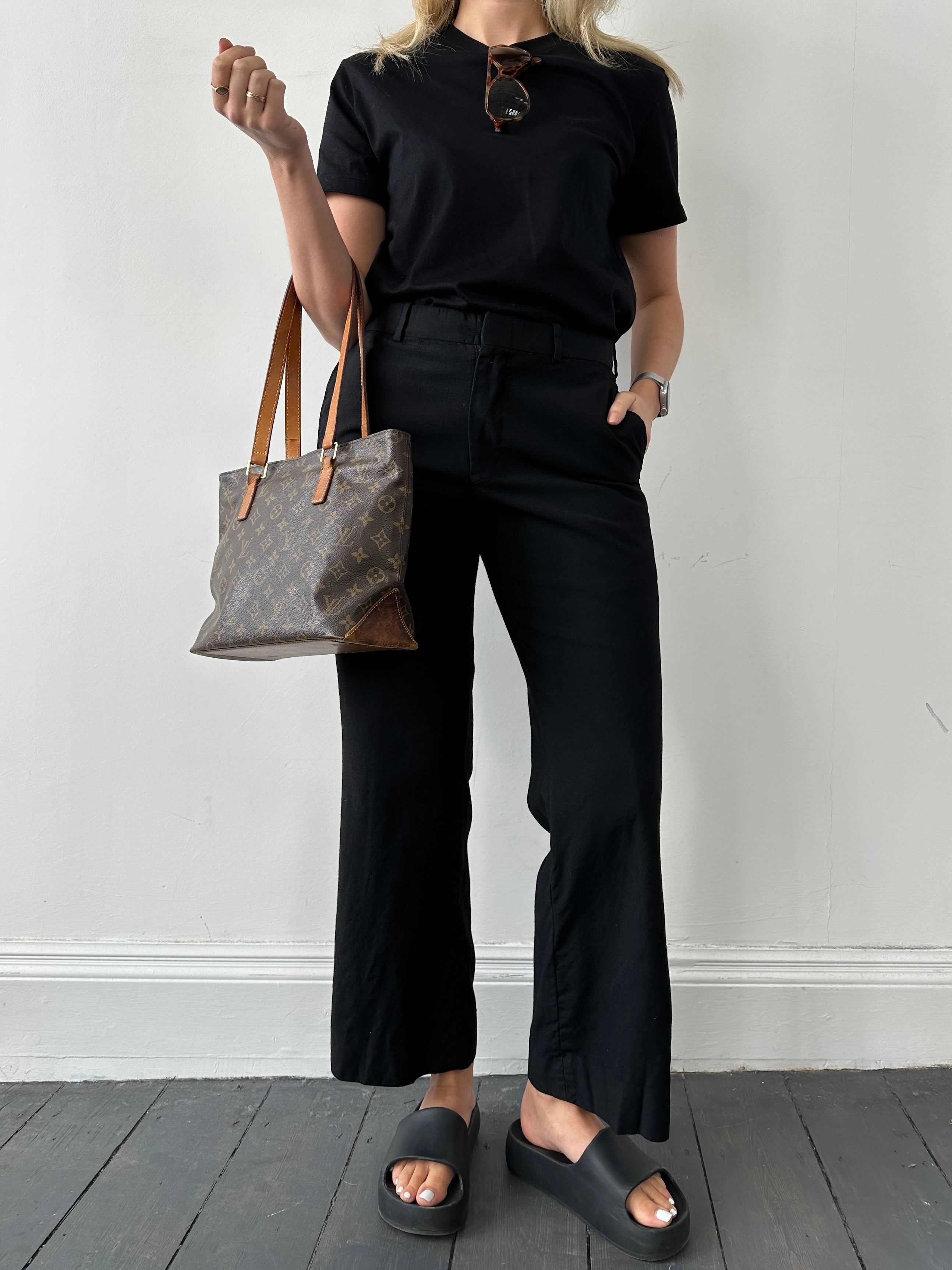Vintage straight-leg wool tailored trousers in W30, showing a close-up of the classic fit and textured fabric details.