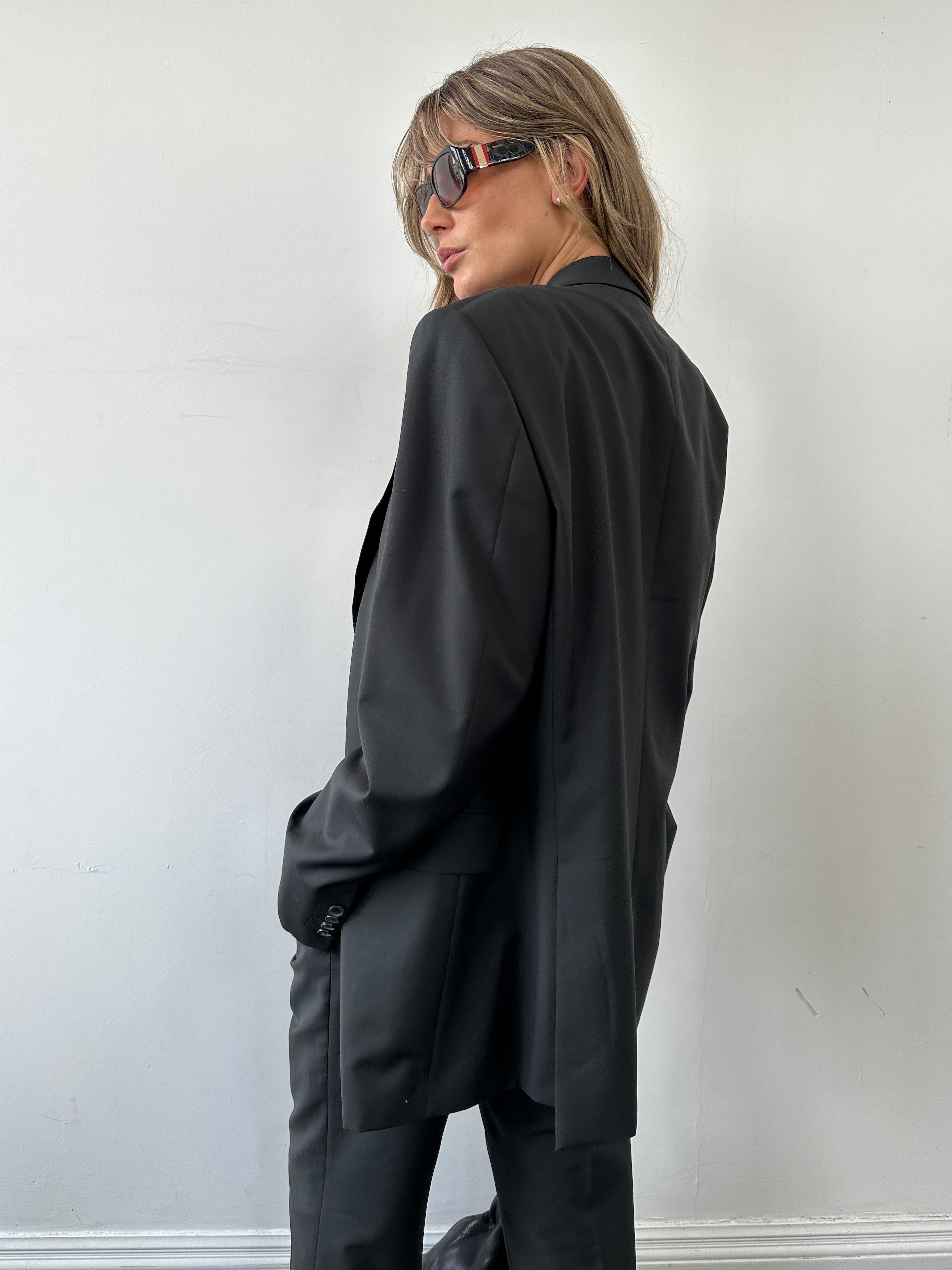Prada mohair wool single-breasted jumpsuit in size 42R/W32, tailored fit, with lapel collar and front buttons.