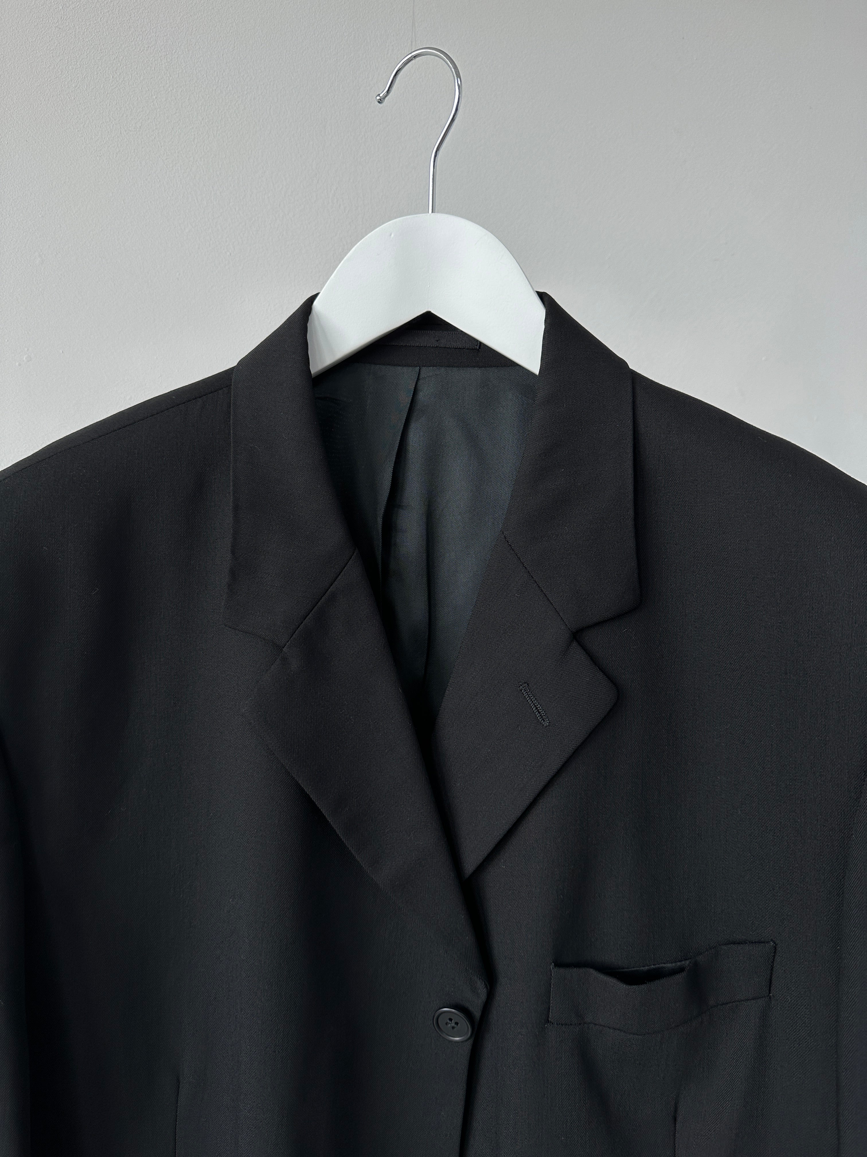 Vintage pure wool tailored single-breasted blazer in size 46/XL, featuring classic design and structured fit.