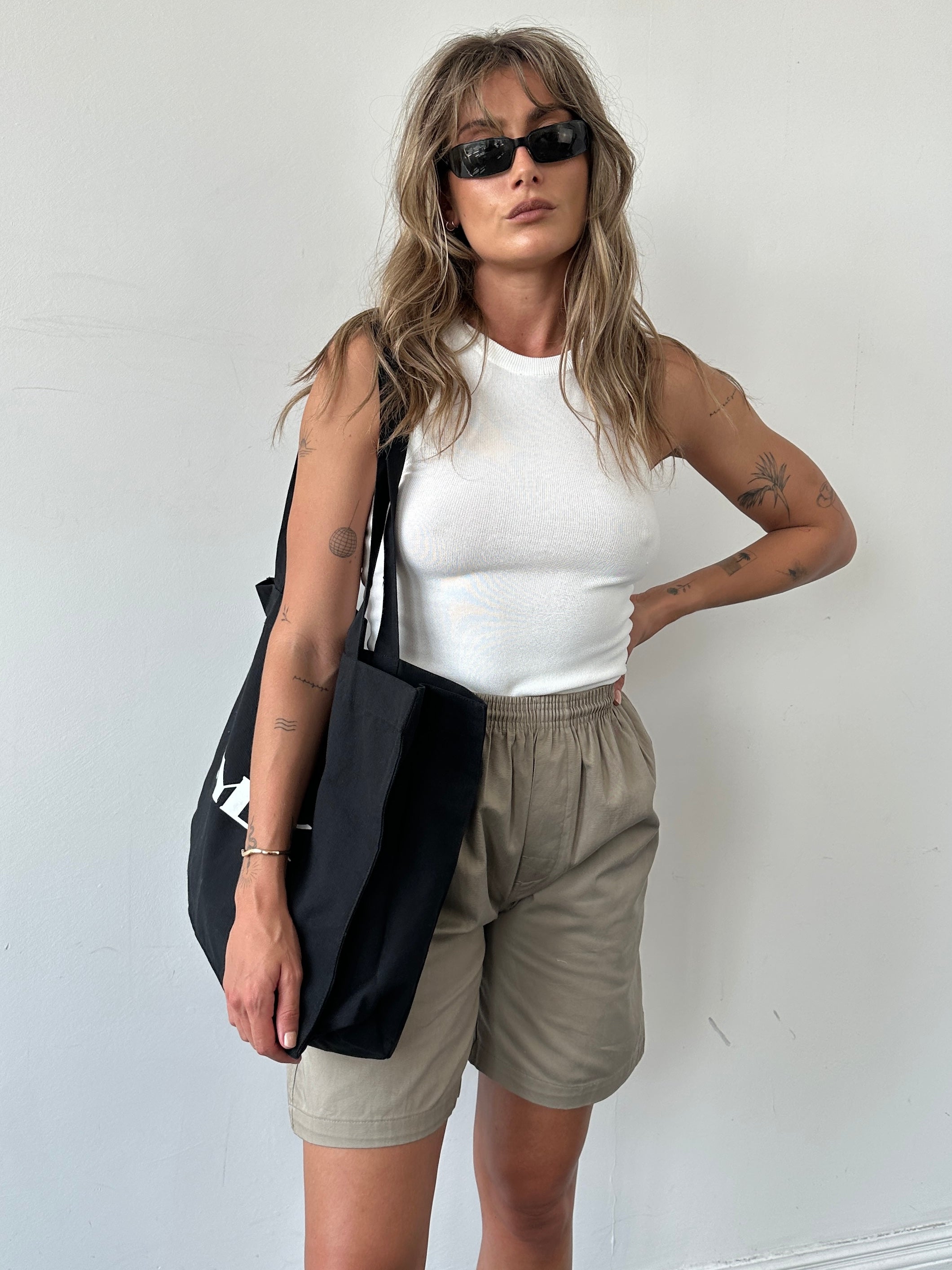 SYLK recycled cotton tote bag with sturdy handles, showcasing eco-friendly design and natural fabric texture.