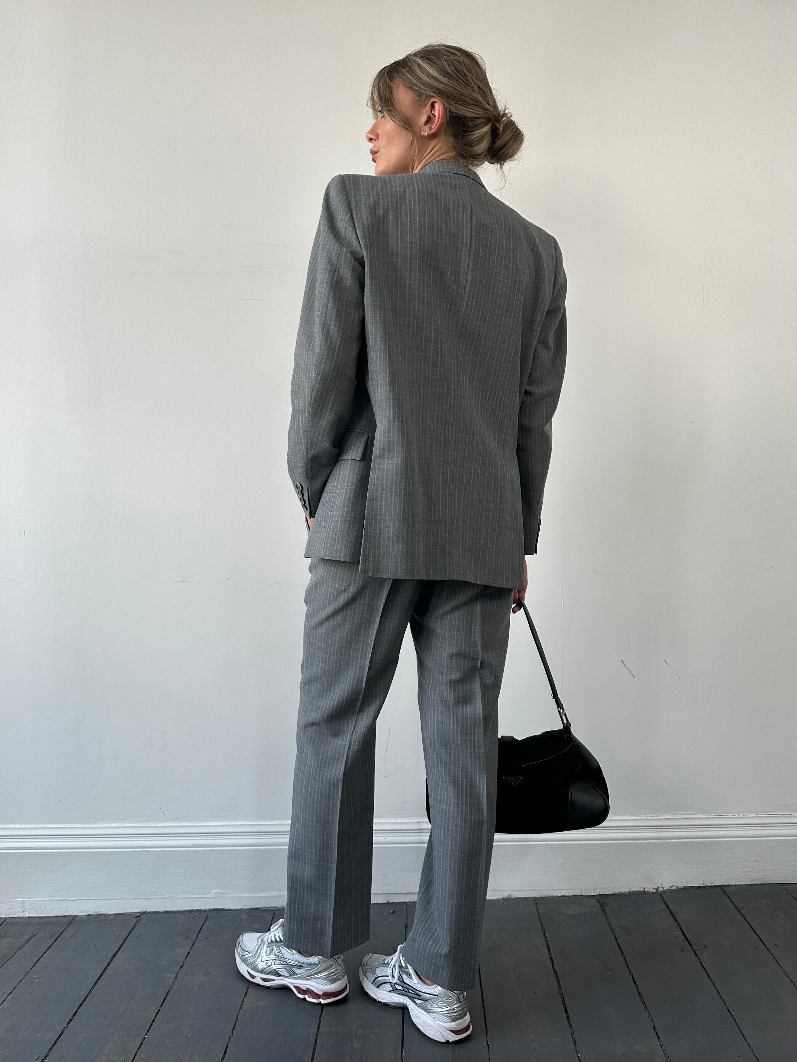 Christian Dior Monsieur pinstripe wool suit in size 40S/W34, featuring a single-breasted blazer and matching trousers.