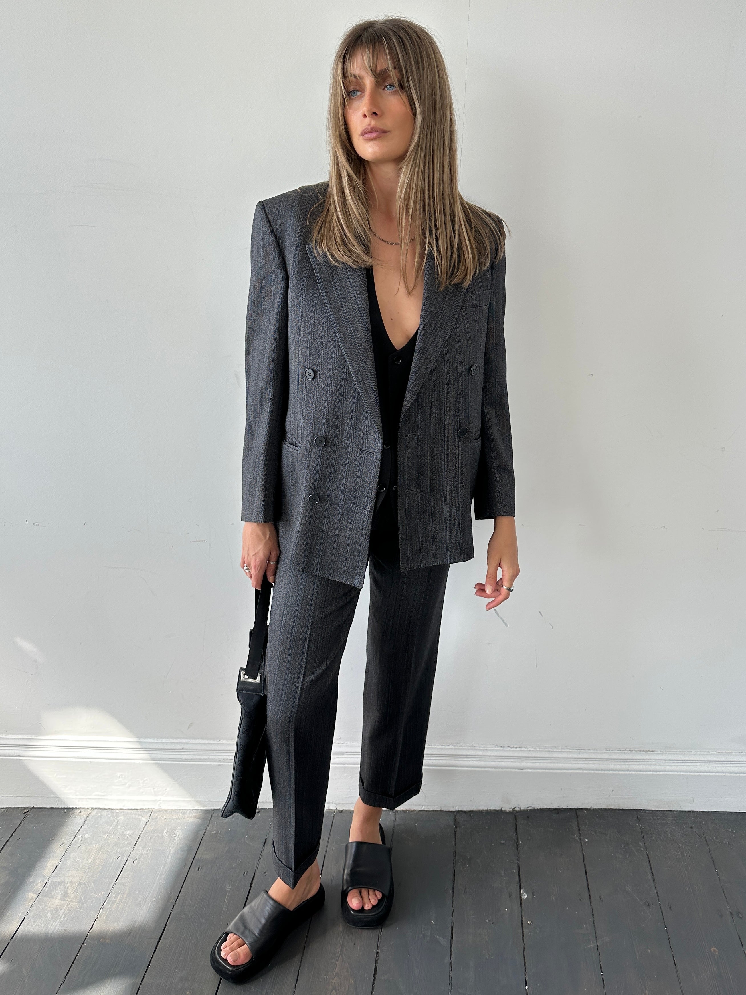 Christian Dior silk wool pinstripe single-breasted jumpsuit in size 36S/W28, featuring a tailored fit and elegant pinstripe design.