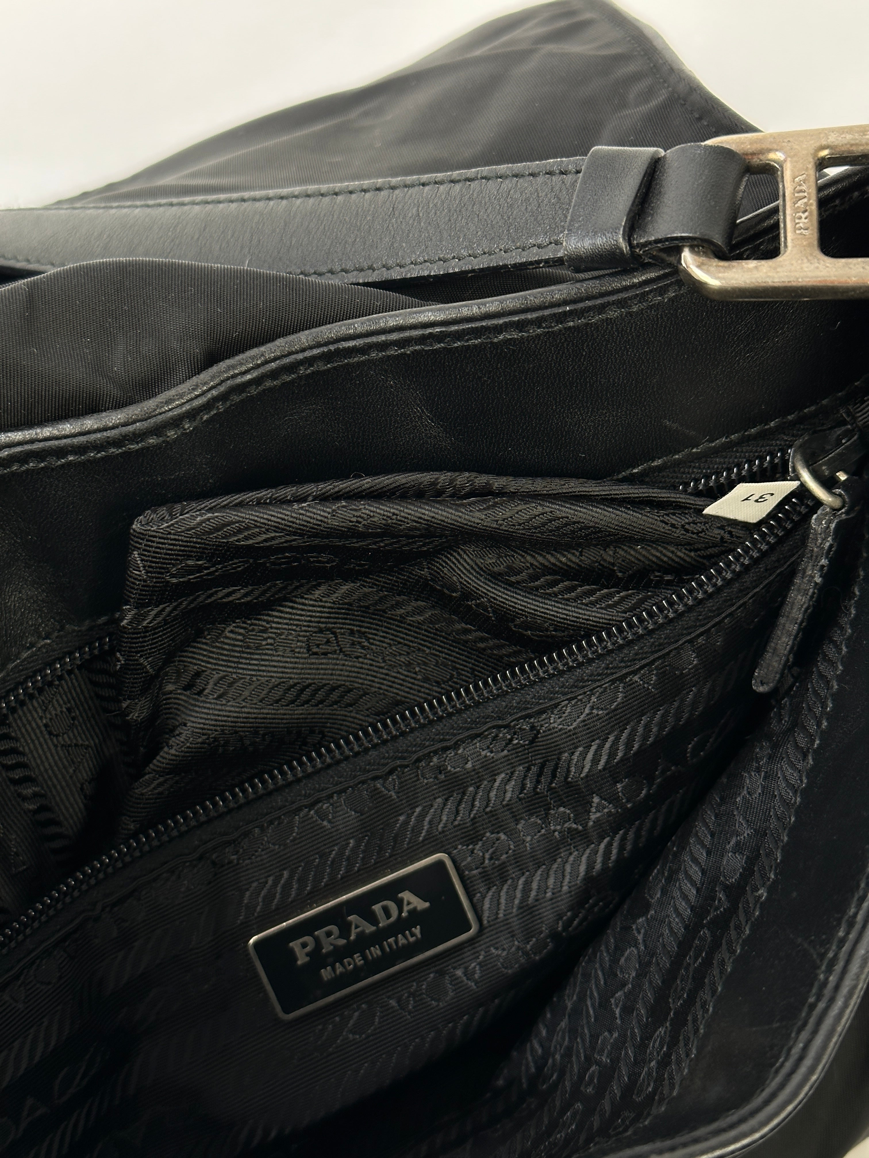 Prada 2000s Tessuto nylon double-sided shoulder bag with sleek design and adjustable strap, showcasing the iconic brand logo.