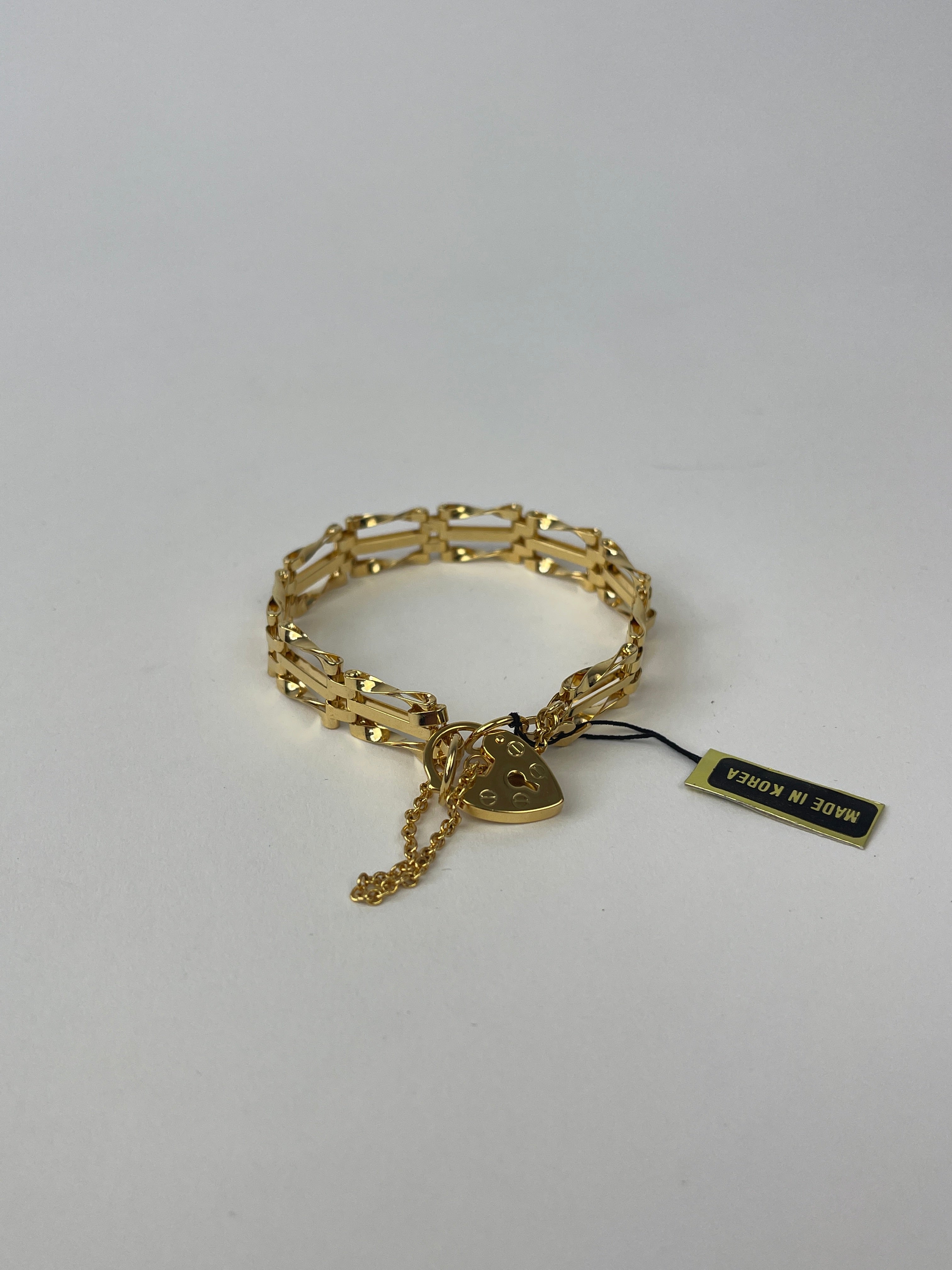 Gold plated Pierre Cardin bracelet featuring a sleek, modern design with a polished finish and adjustable clasp.