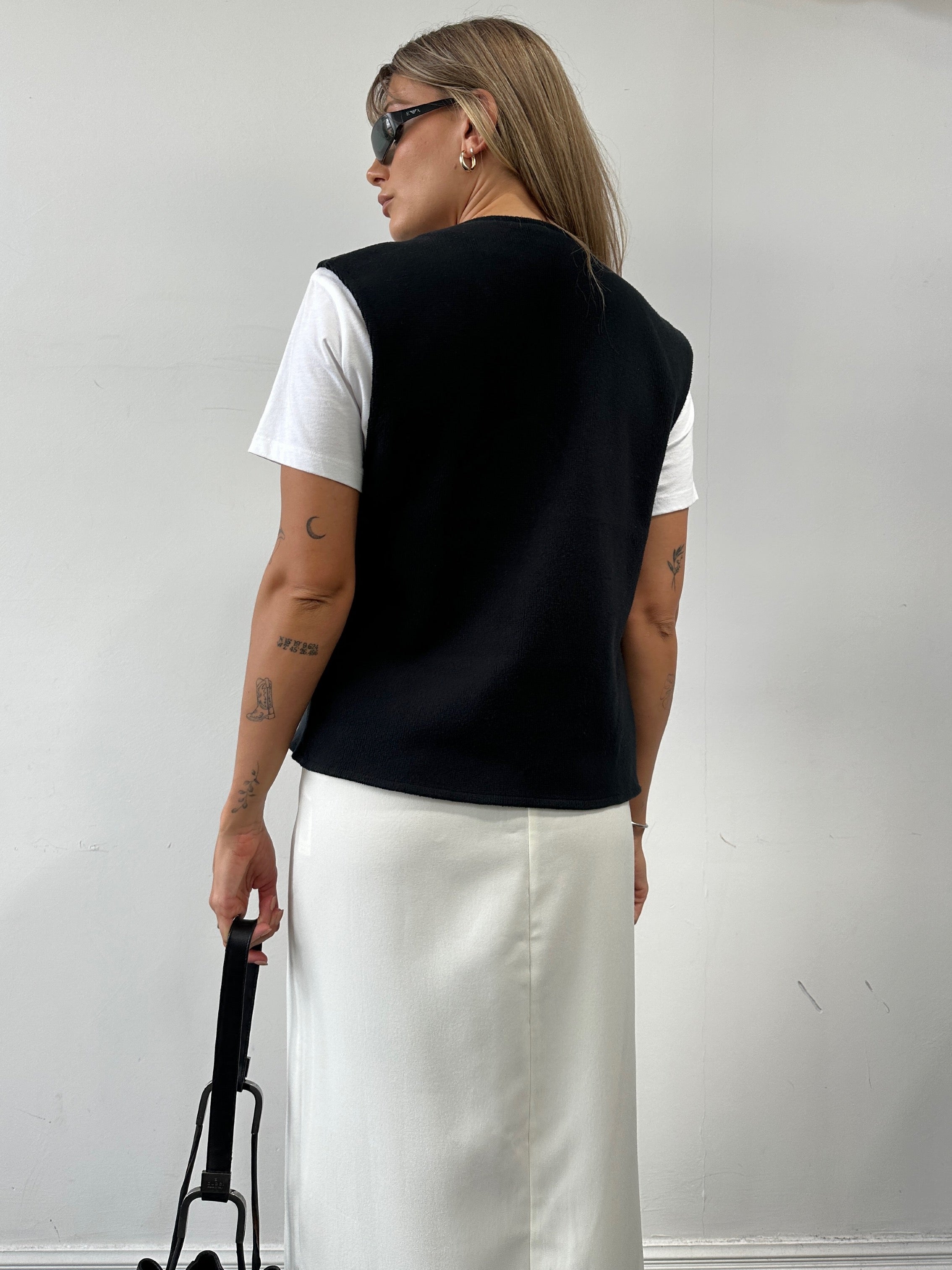 Giorgio Armani cotton knitted logo waistcoat in black, featuring a front logo detail and a comfortable S/M fit.