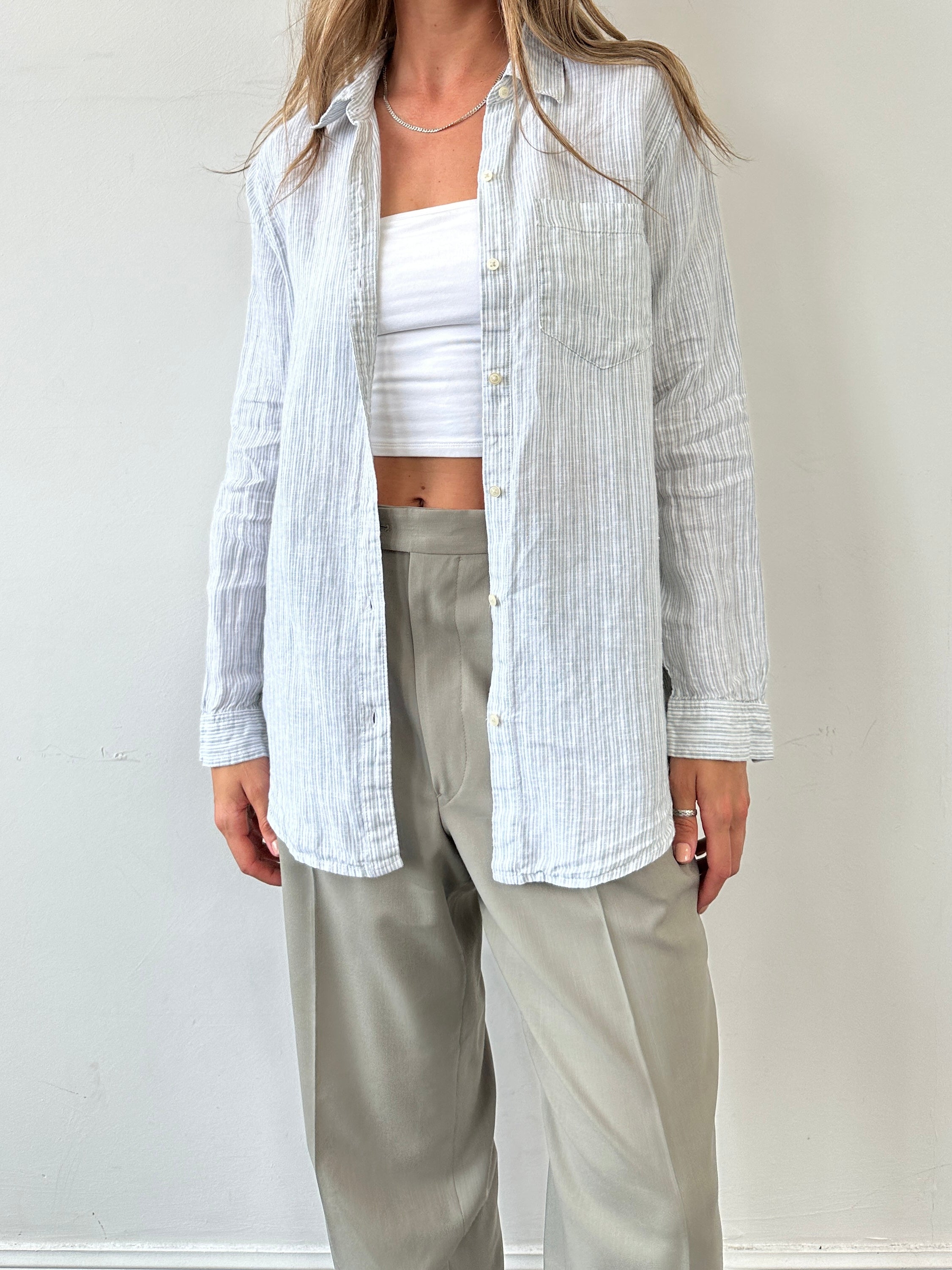 GAP Pinstripe Linen Shirt for men, size M, featuring lightweight fabric and classic pinstripe pattern, displayed on a hanger.