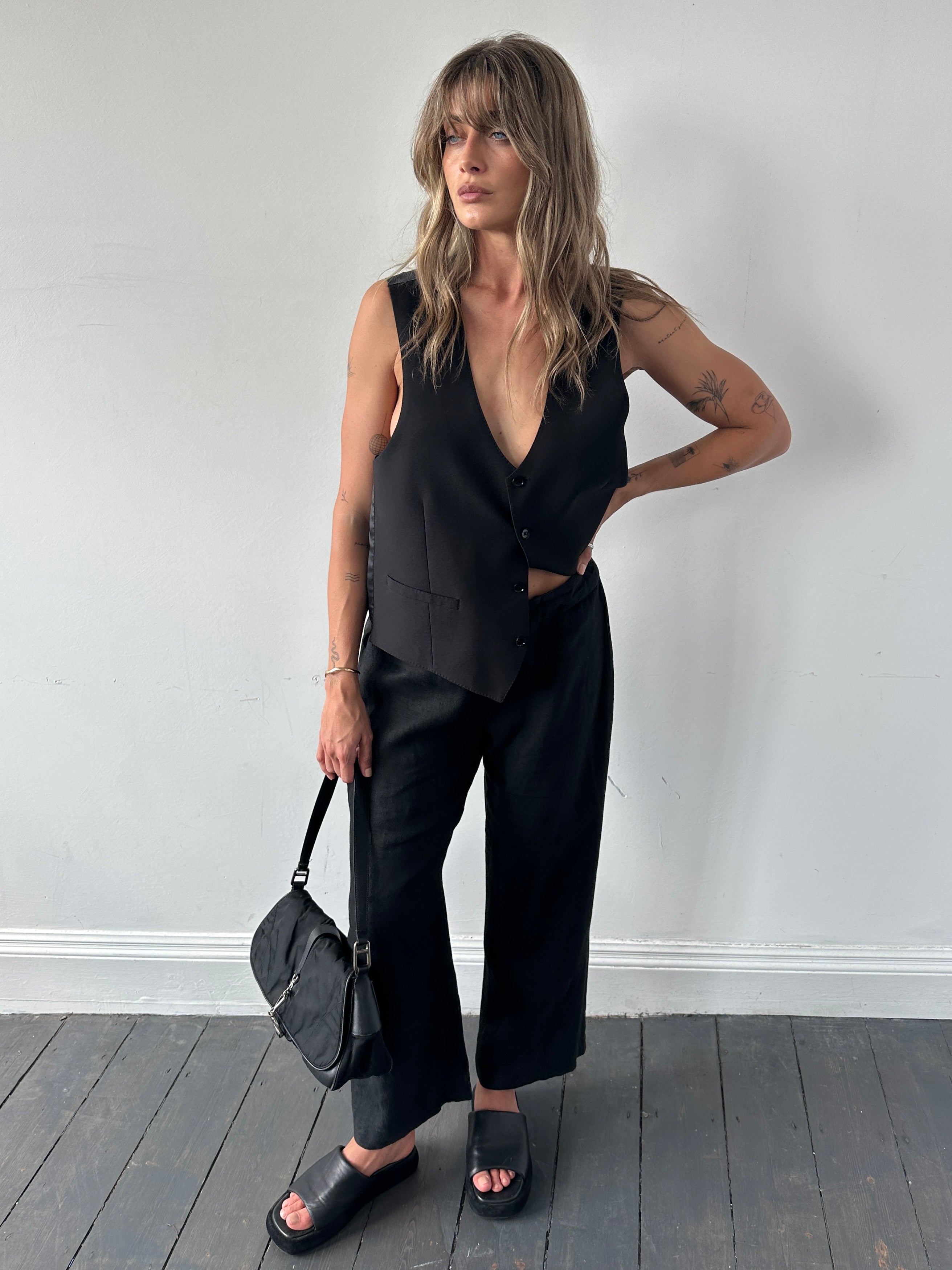 Light beige Jaeger linen wide-leg trousers with elastic waistband, displayed flat with visible tailored seams and relaxed fit.
