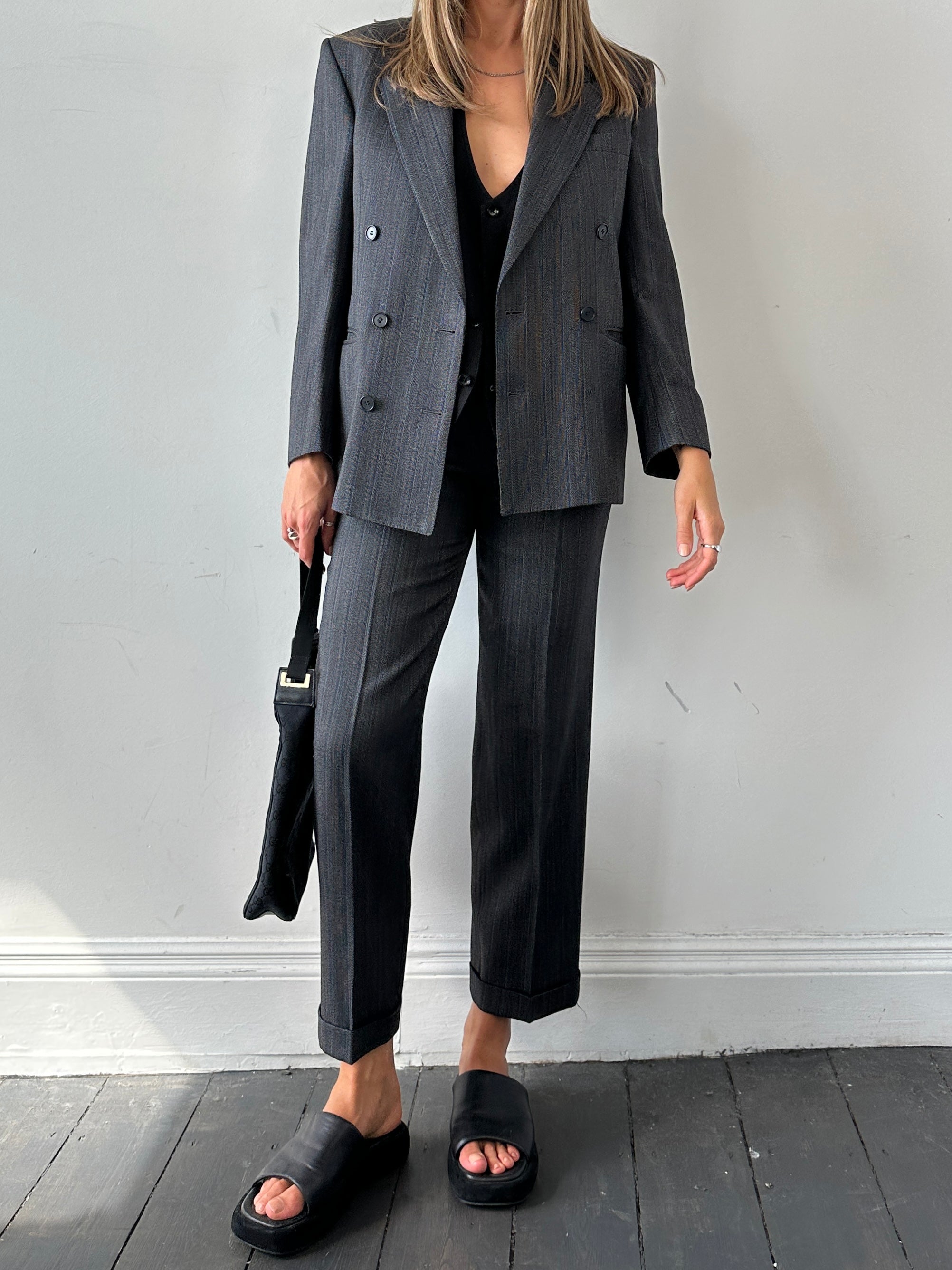 Christian Dior silk wool pinstripe single-breasted jumpsuit in size 36S/W28, featuring tailored lapels and classic pinstripe pattern.
