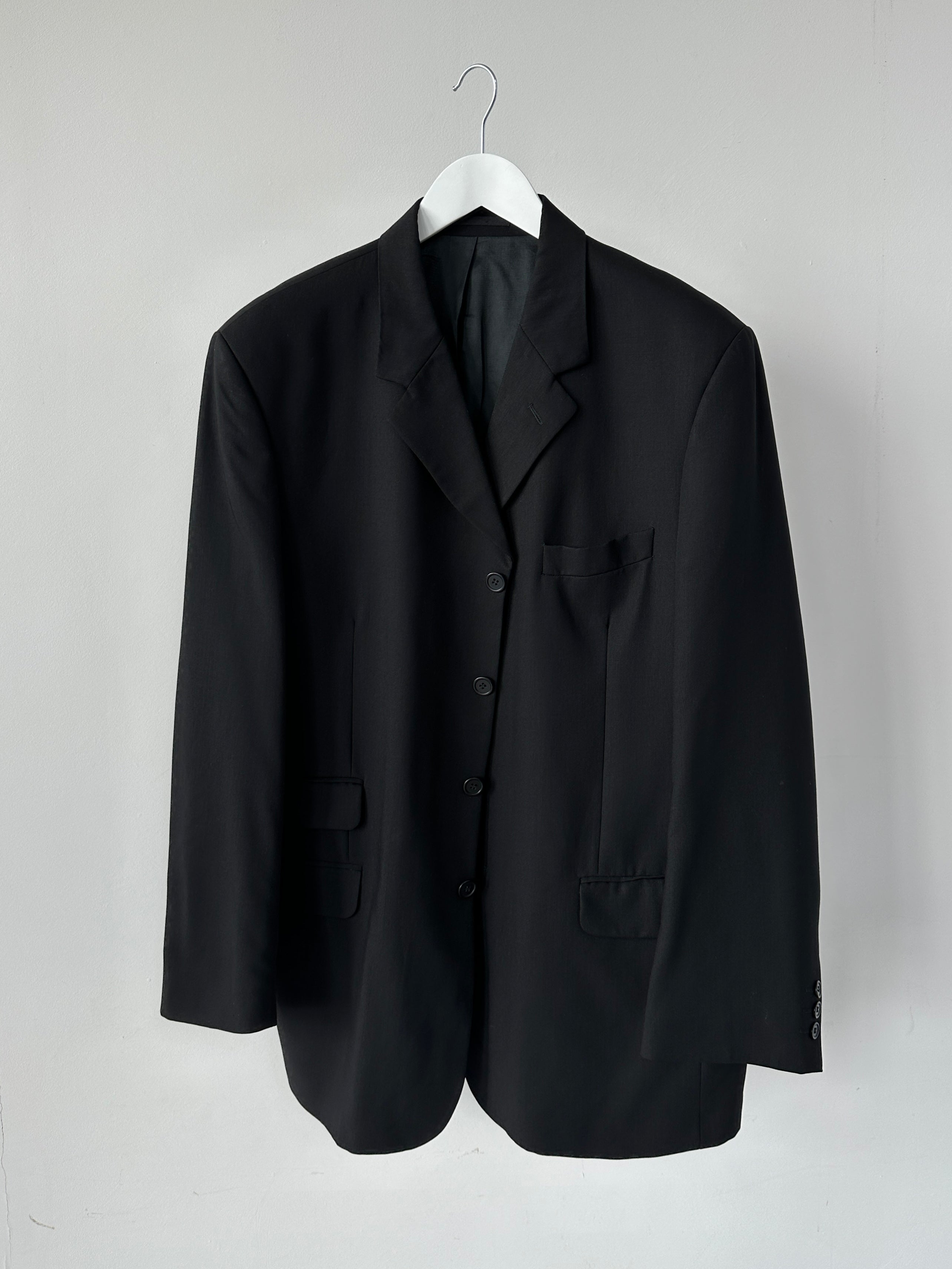 Vintage pure wool tailored single-breasted blazer in size 46/XL, featuring classic design and structured fit.
