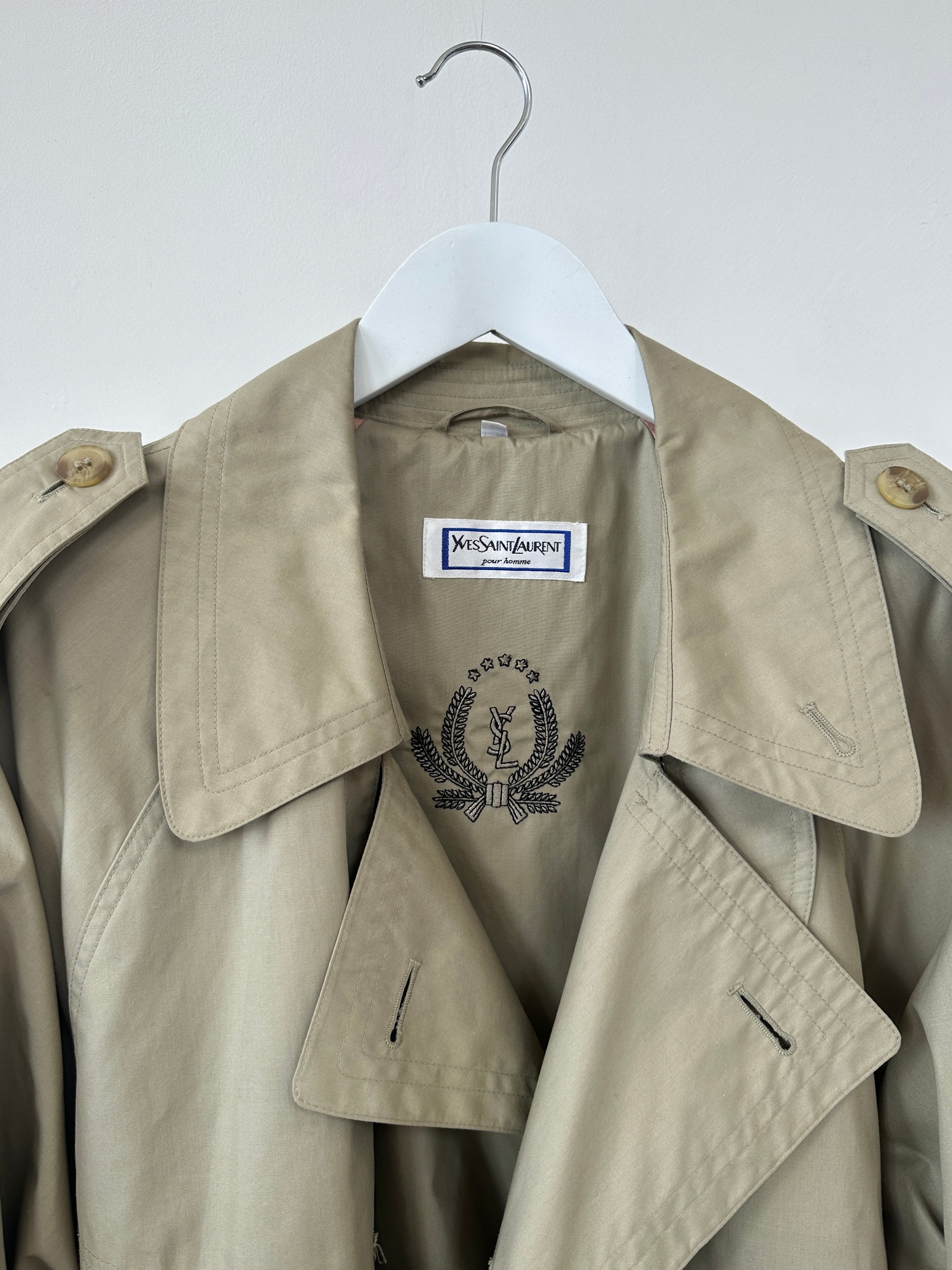 Yves Saint Laurent double-breasted trench coat in size L/XL, beige fabric with classic collar and button details.