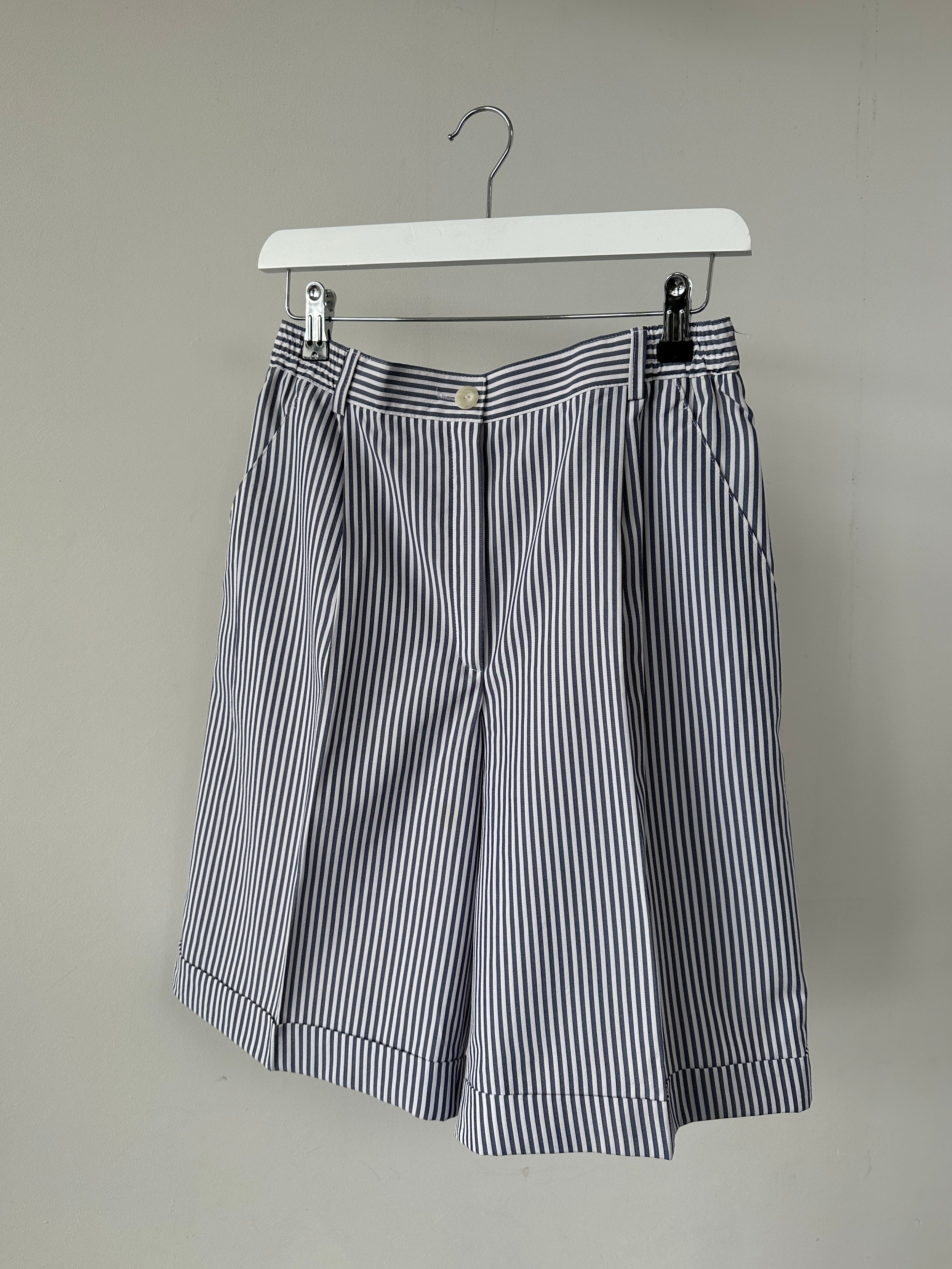 Vintage brand vintage stripe pleated shorts in size W28, showing the front view with pleats and retro-inspired design.