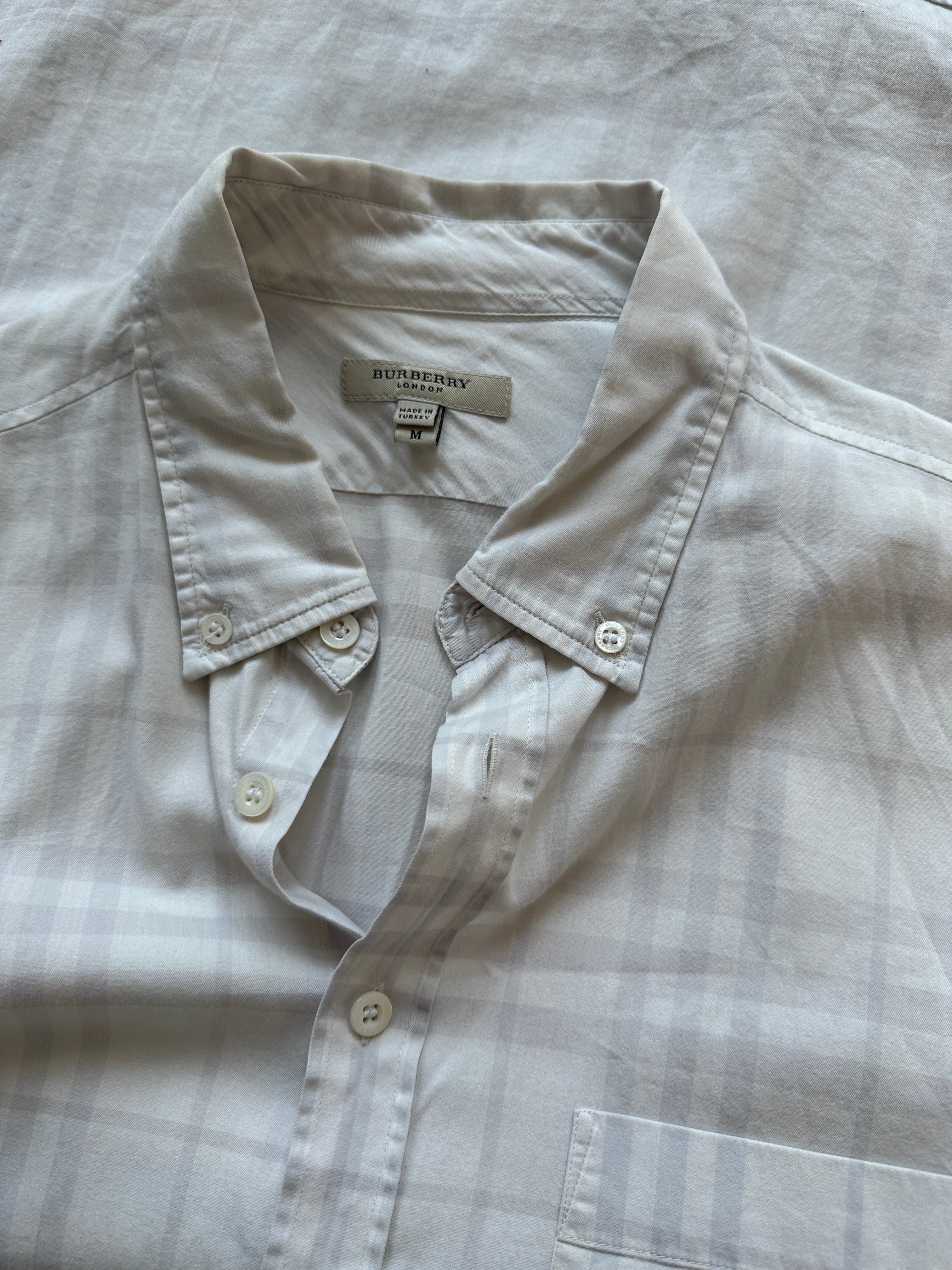 Burberry London Check cotton shirt in size S/M, featuring classic plaid pattern and button-down collar.