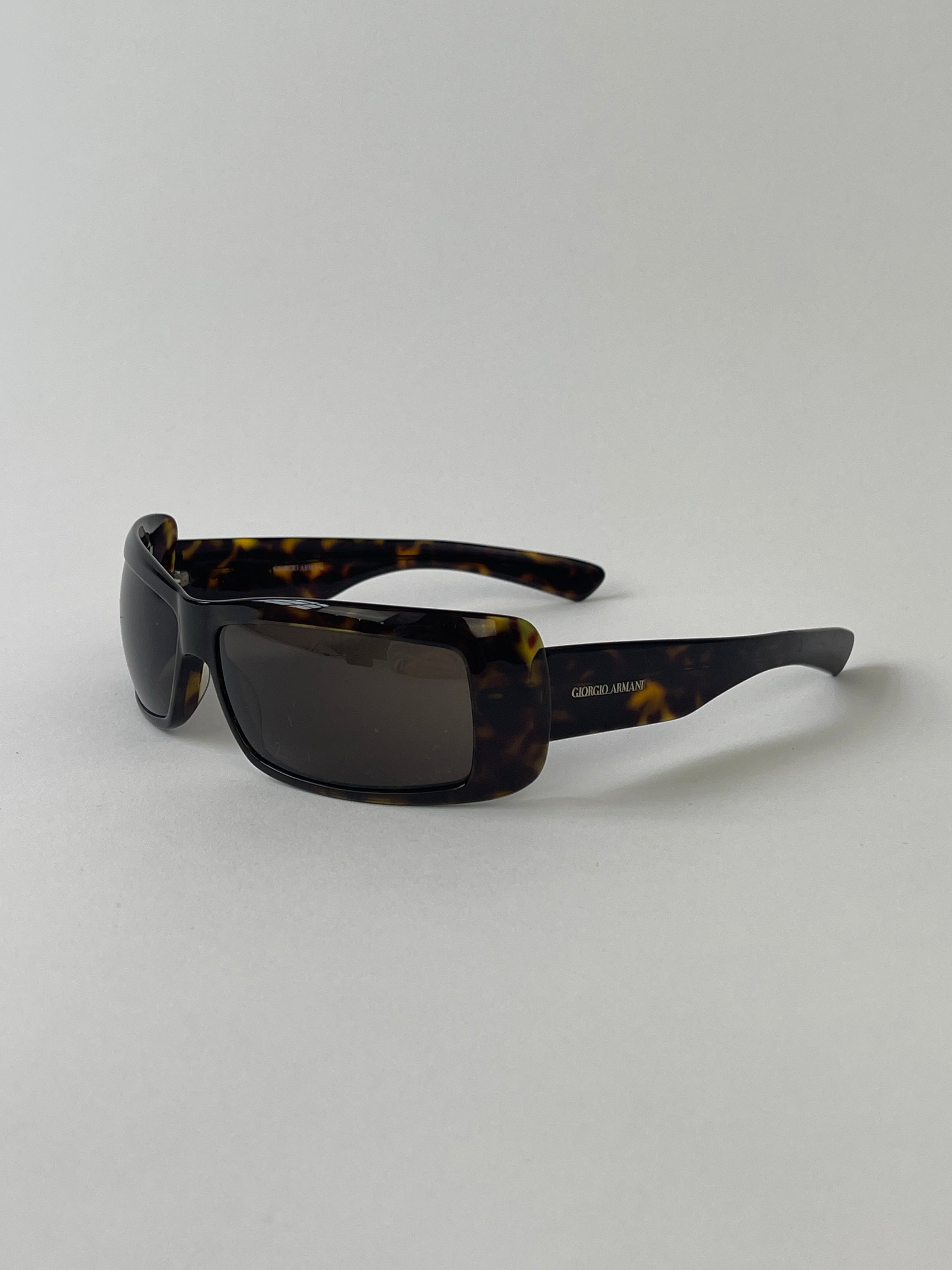 Giorgio Armani rectangle tortoise shell sunglasses with brown lenses and classic design, showcasing stylish eyewear.