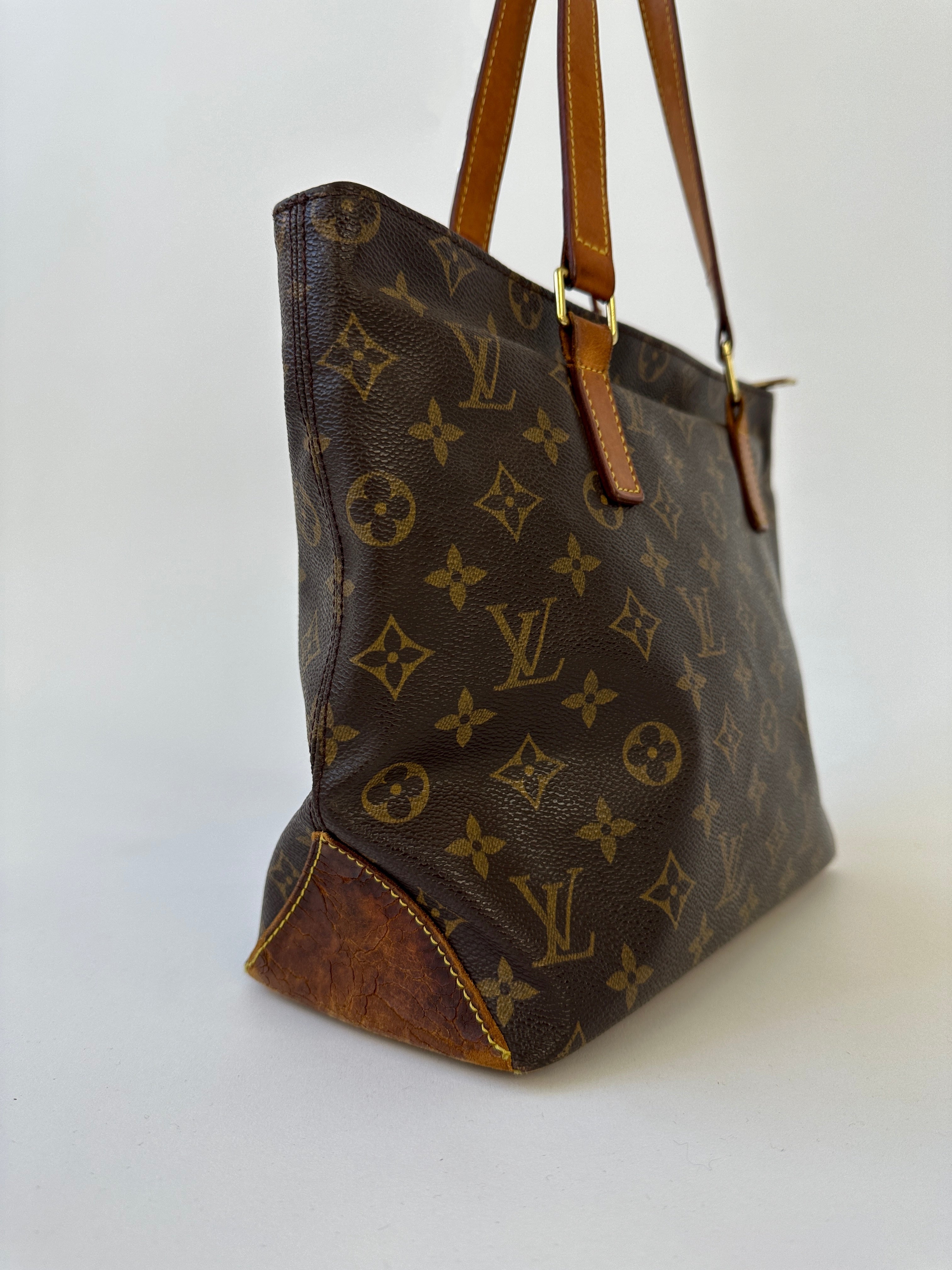 Louis Vuitton 2002 Cabas Mezzo Monogram shoulder bag with leather handles and spacious interior, showcasing signature monogram canvas.