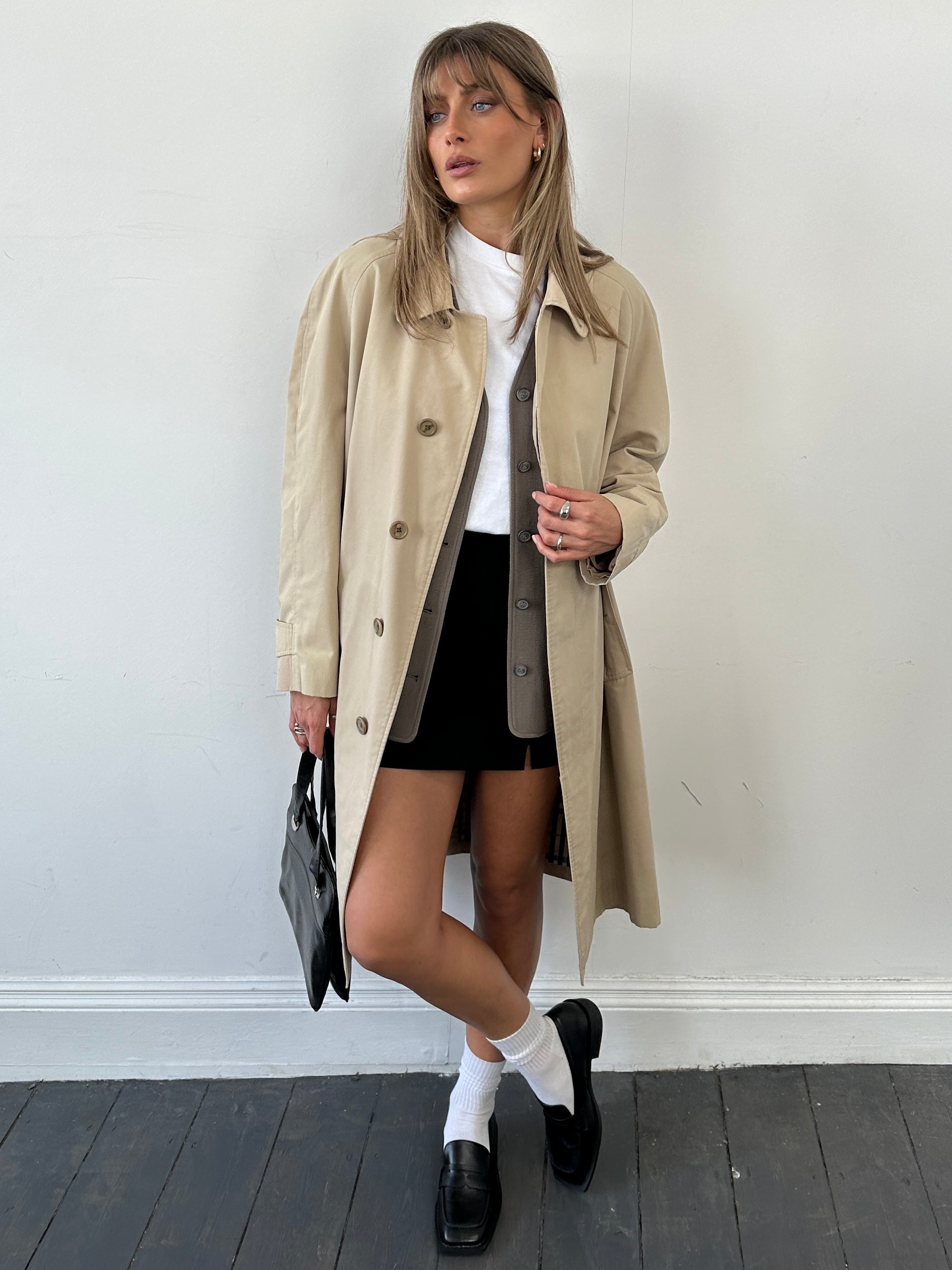 Burberry Nova Check trench coat in size L, featuring classic check pattern, double-breasted design, and belted waist.