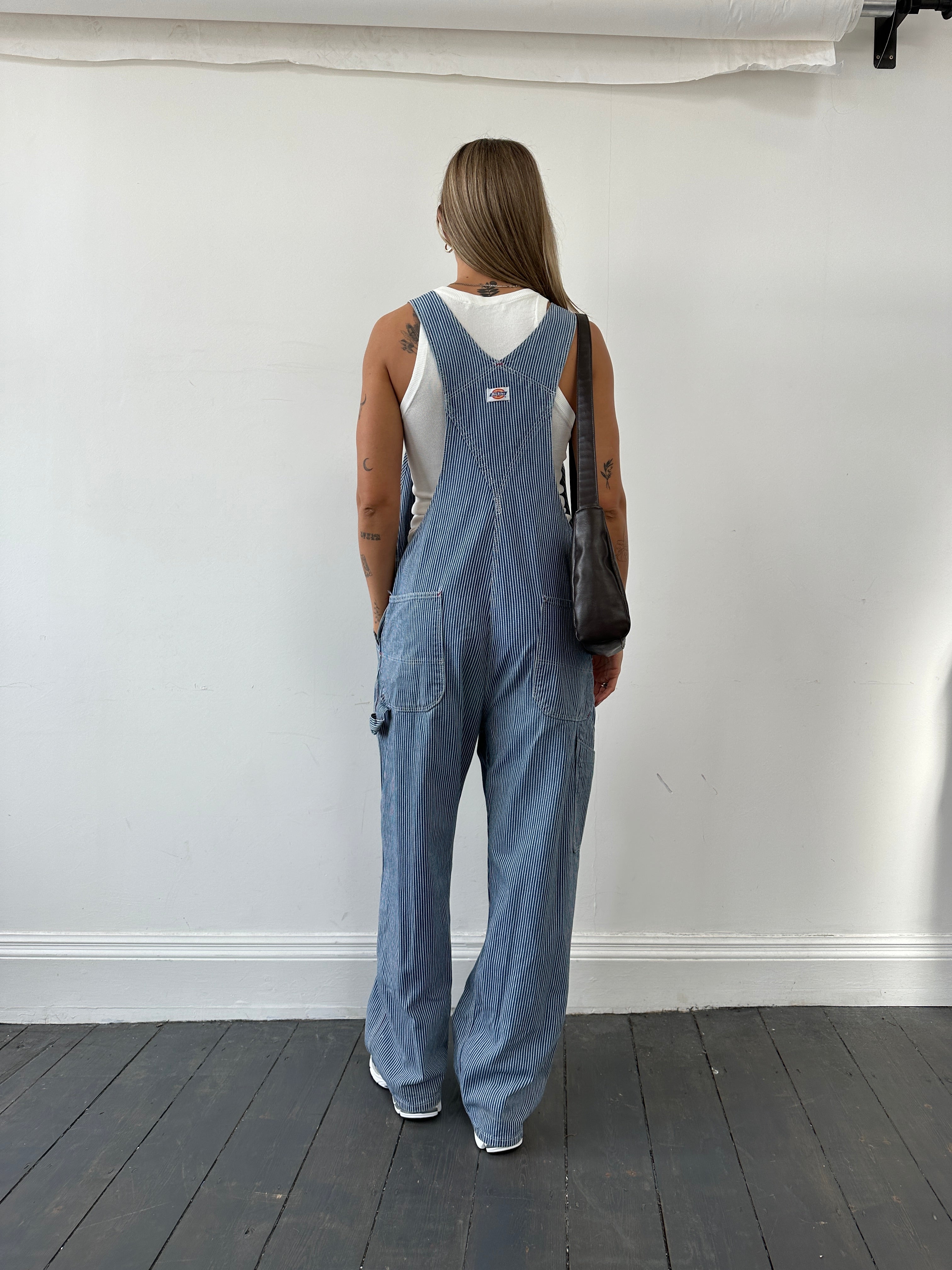 Dickies pinstripe pure cotton dungarees in size M/L, front view showcasing adjustable straps and classic workwear design.