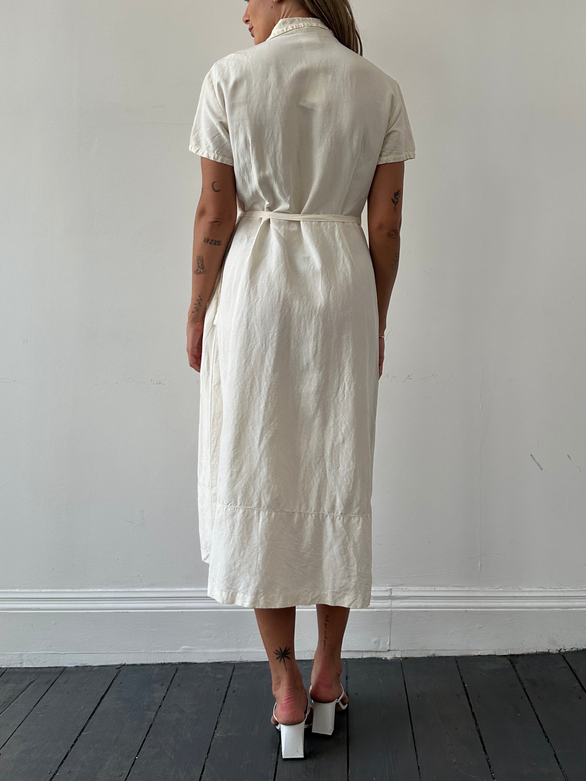 Laura Ashley silk linen maxi wrap dress in S/M, featuring a flowing design and elegant neckline, displayed on a mannequin.