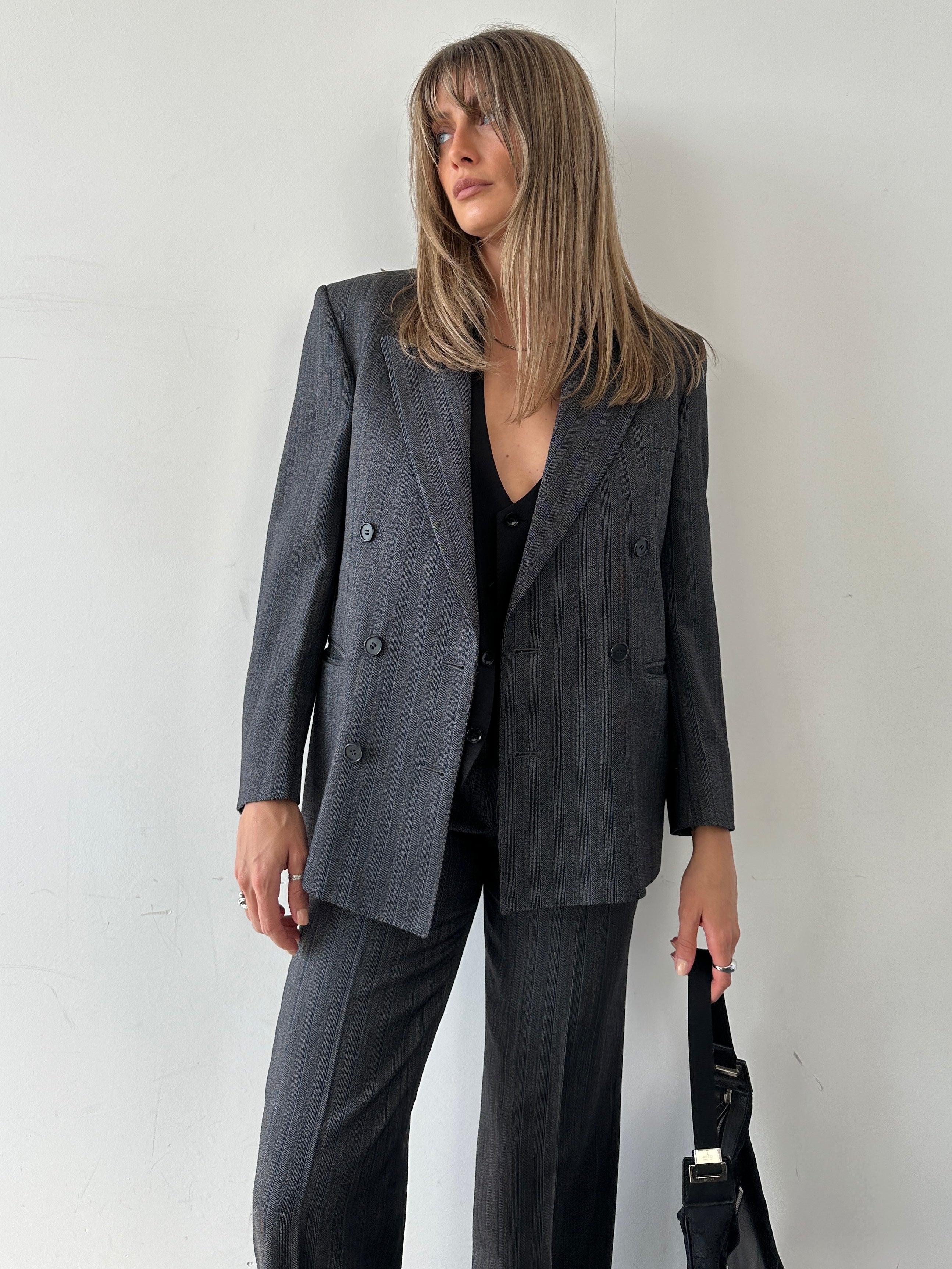 Christian Dior silk wool pinstripe single-breasted jumpsuit in size 36S/W28, showcasing tailored fit and classic pinstripe pattern.