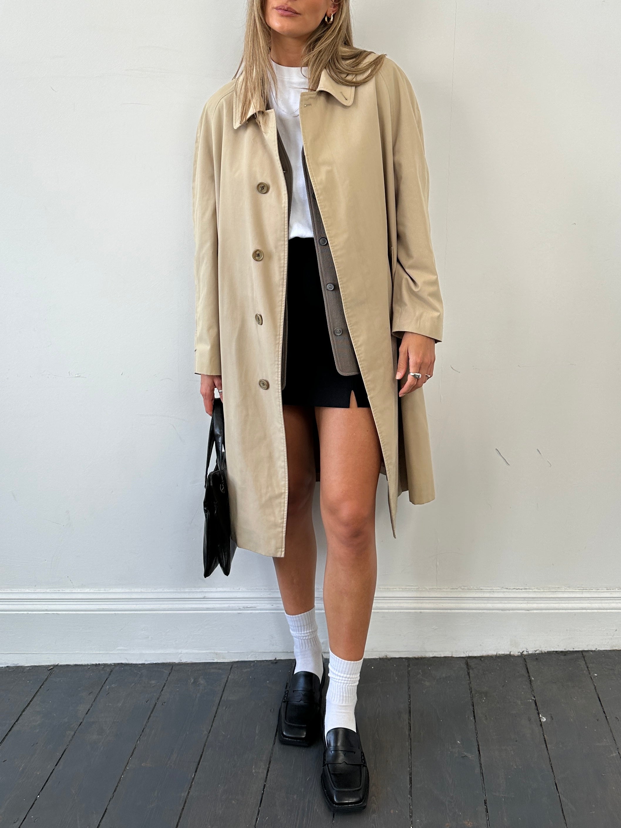 Burberry Nova Check trench coat in size large, featuring classic beige and check pattern, tailored silhouette, and button details.