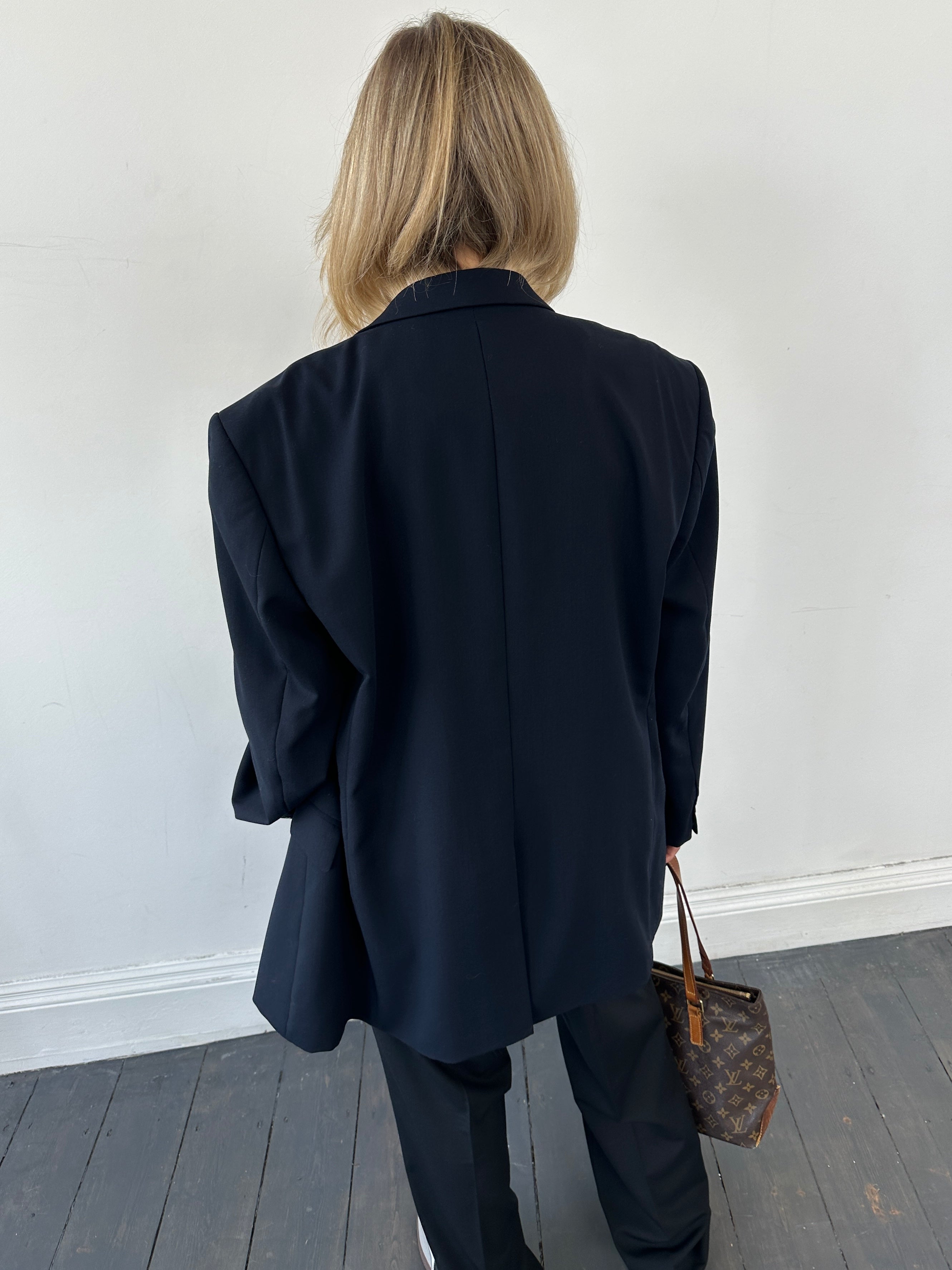 Balmain Paris single-breasted wool blazer in size 44R/L, tailored fit with classic lapels and sleek design.