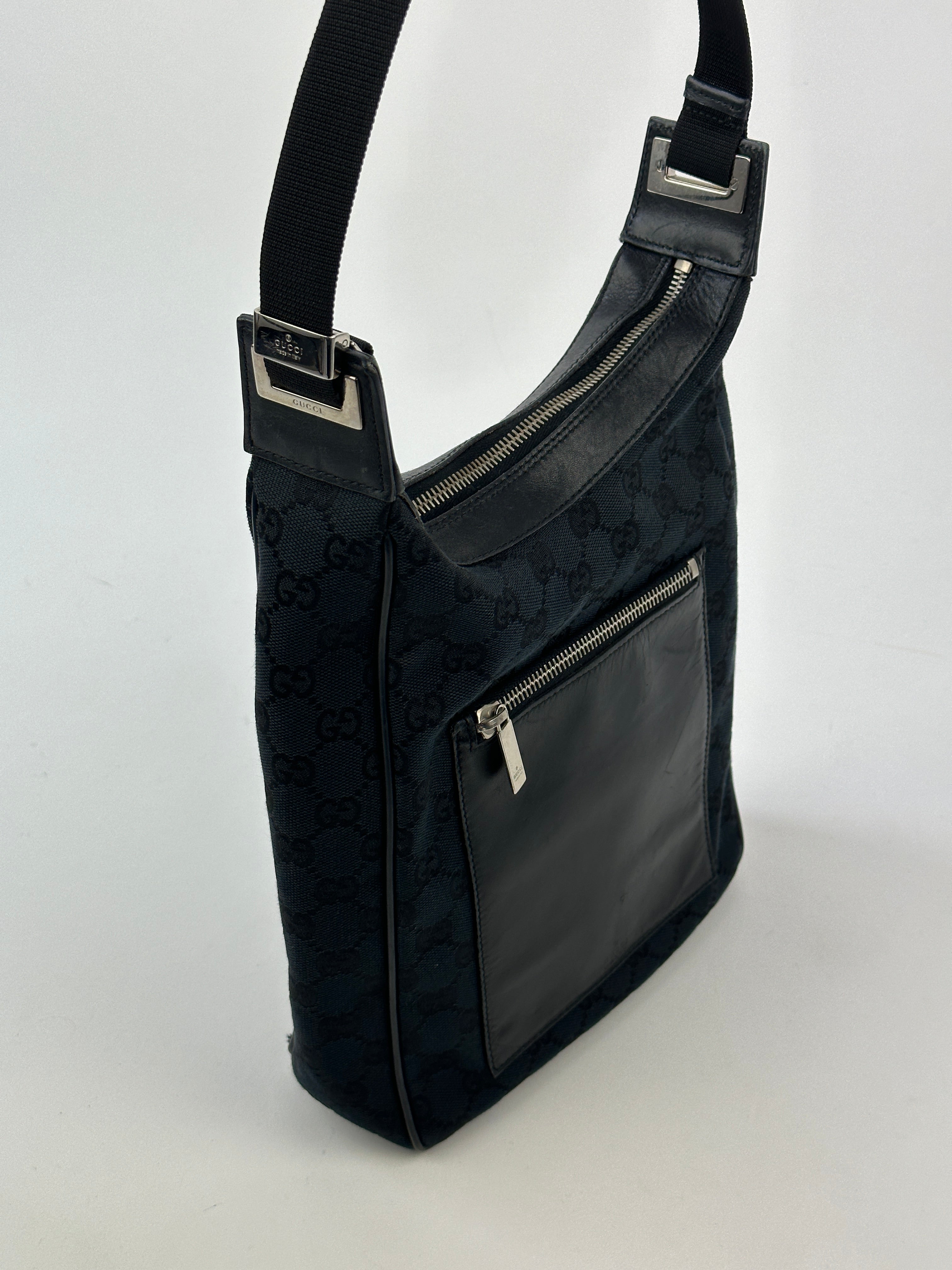 Gucci GG Monogram Canvas Leather Shoulder Bag showing the signature monogram pattern, leather strap, and gold-tone hardware.