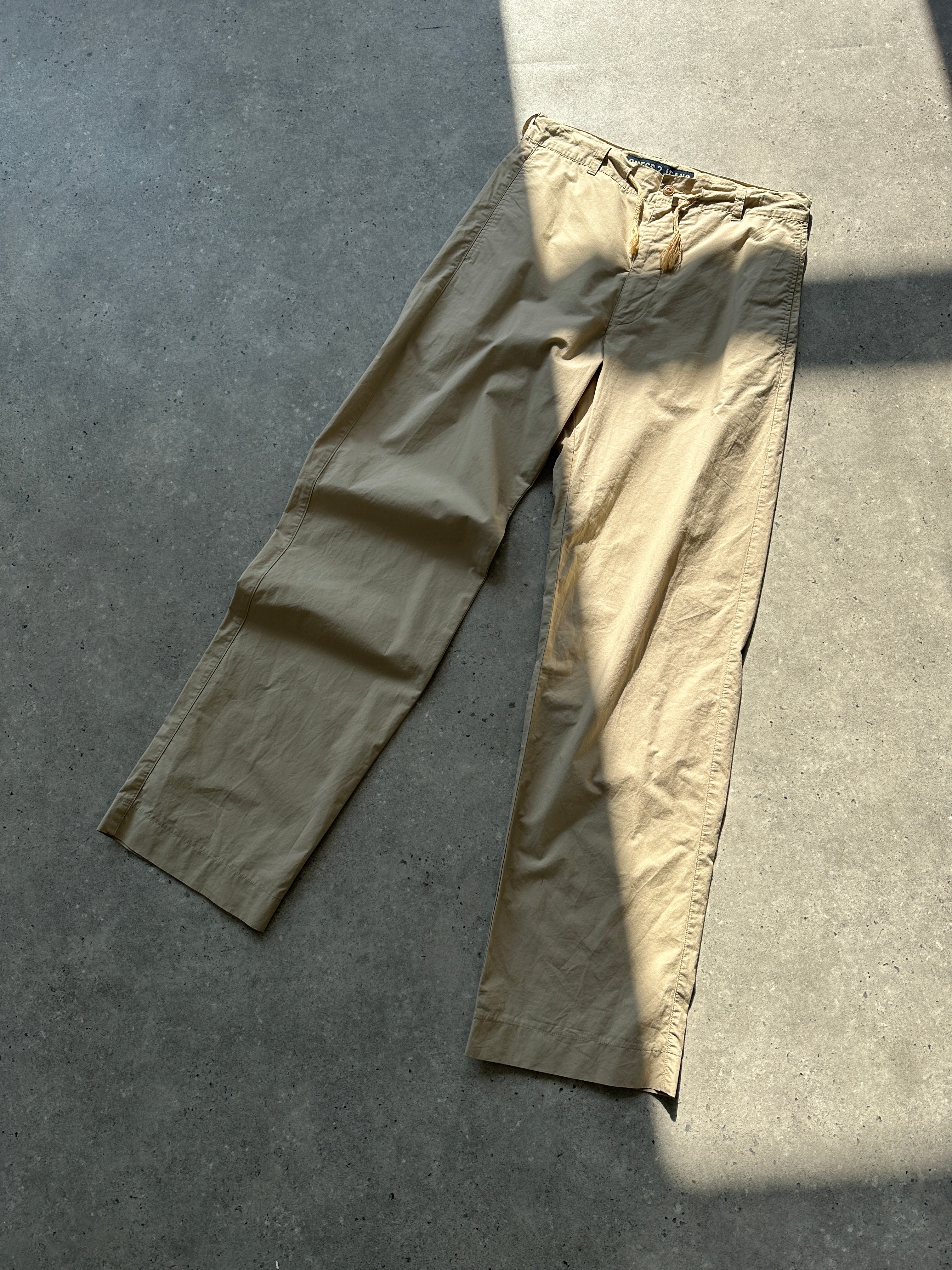 Guess cotton pull-on straight-leg trousers in W29, featuring a clean design and classic fit, shown on a model.