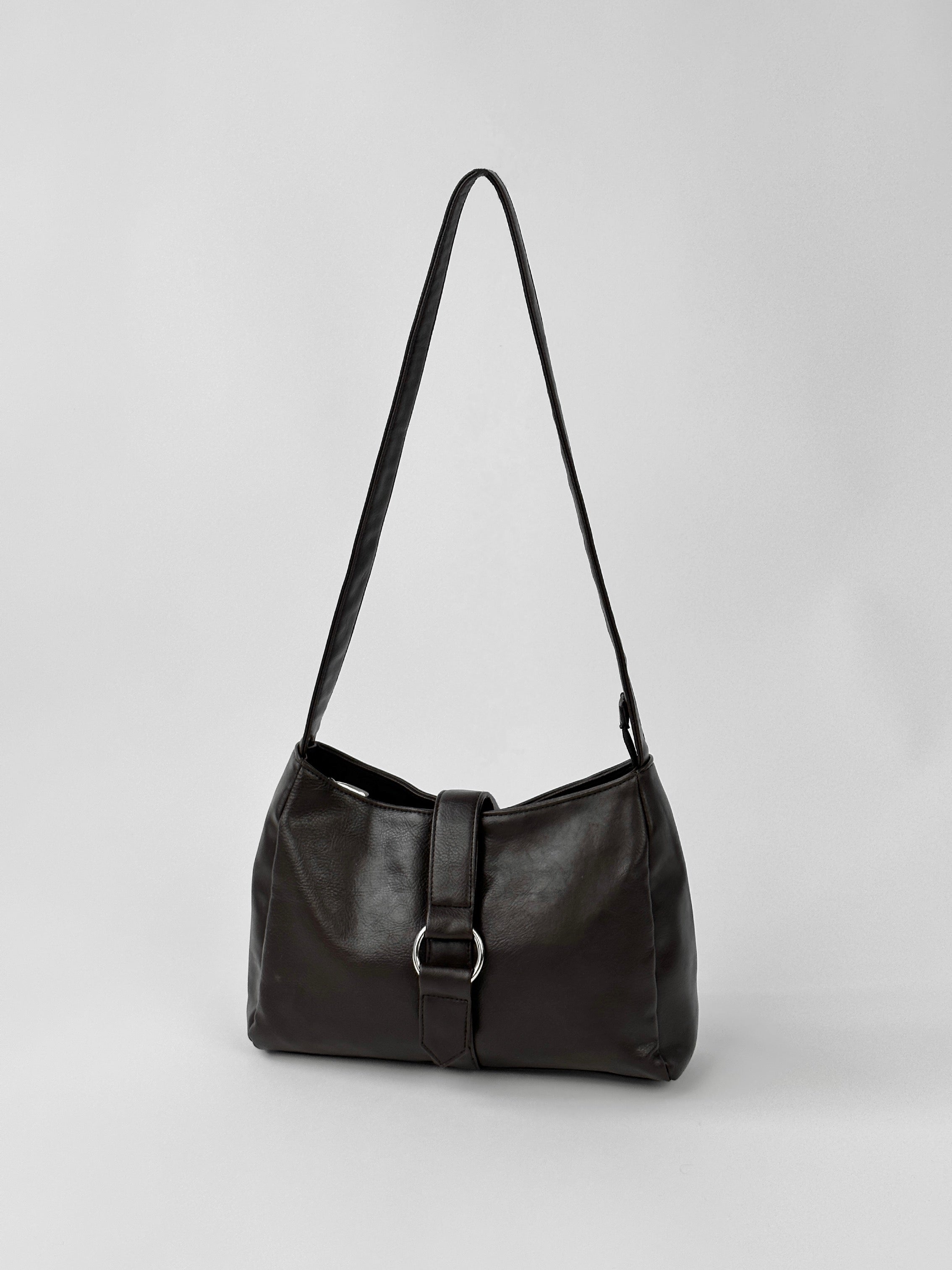Vintage 2000s faux leather shoulder bag with silver hardware, featuring a classic design and adjustable strap.